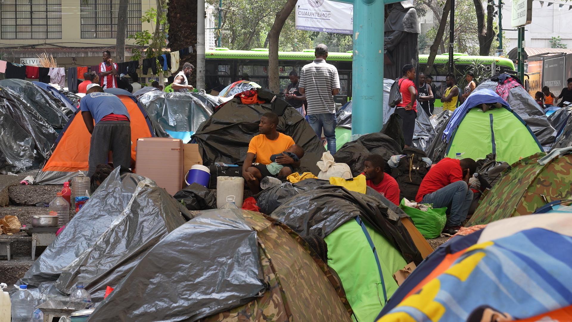 Hundreds of Haitians set up a camp at a park in Mexico City's trendy Roma neighborhood.