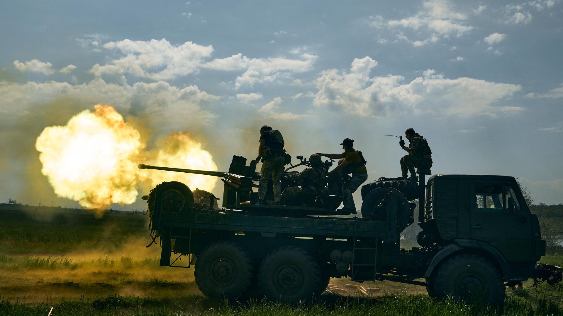 Ukrainian soldiers fire a cannon near Bakhmut on Monday, May 15, 2023.