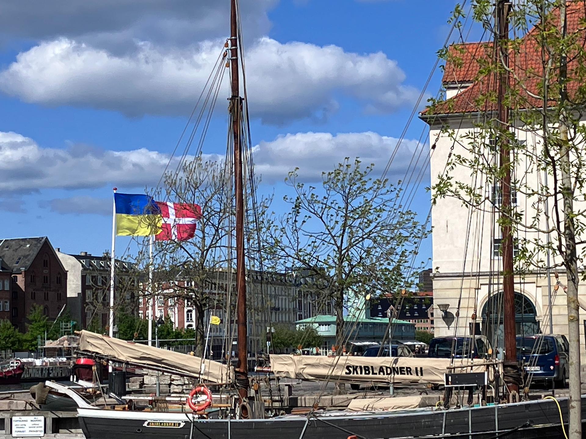 Ukrainian and Danish flags wave together in front of Ukraine House in Copenhagen, Denmark, May 17, 2023.
