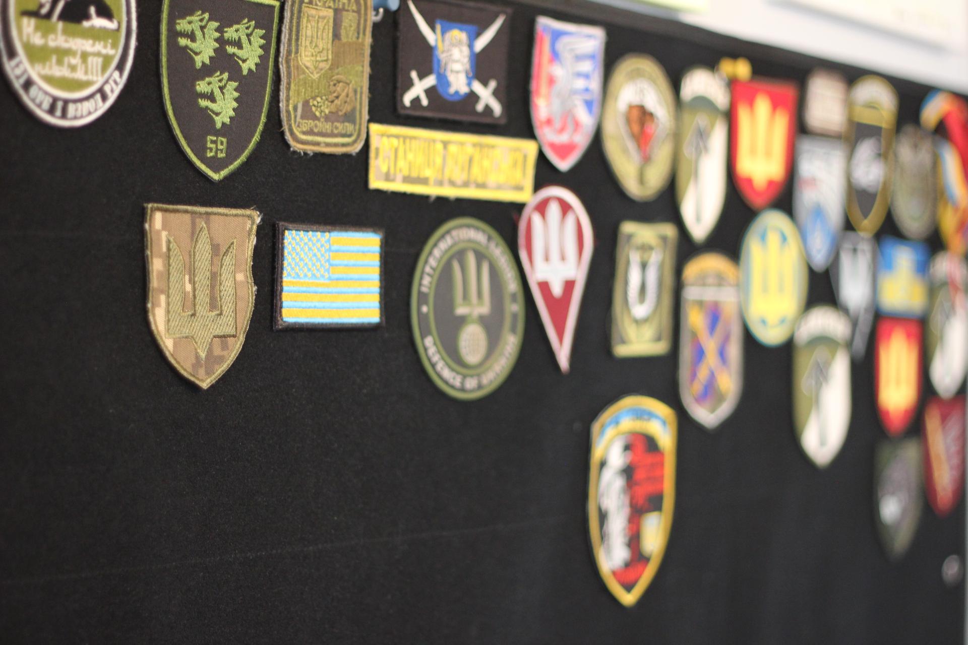 badges and medals on the wall