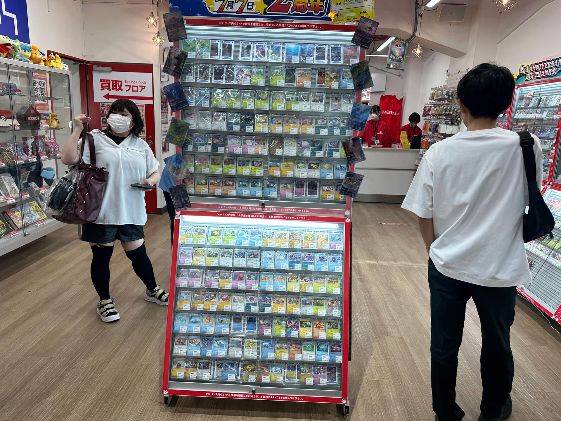 A few customers sneak into a card shop just before closing time in Akihabara, Tokyo. 