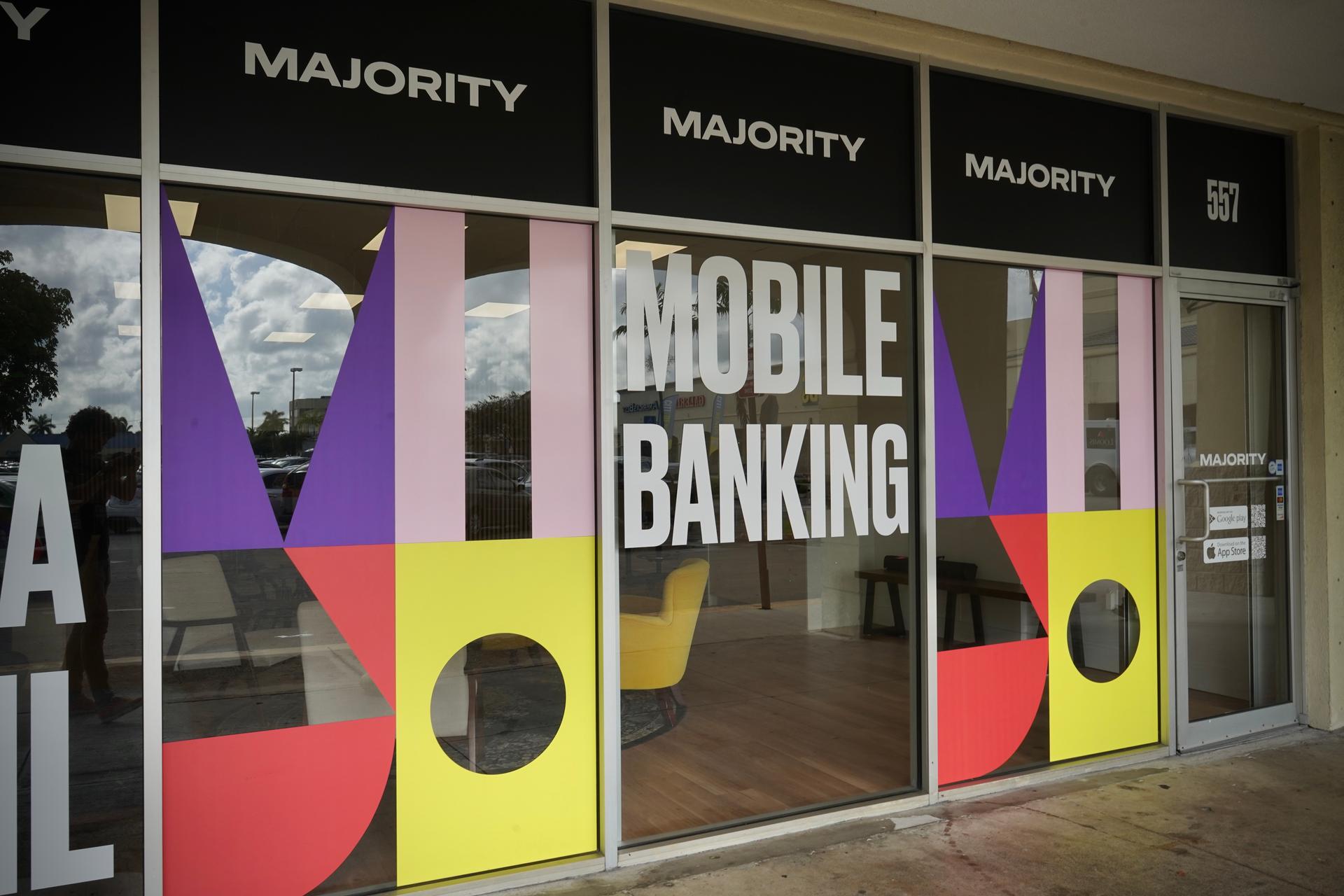 Outside of a colorful glass building with big white text that reads mobile banking