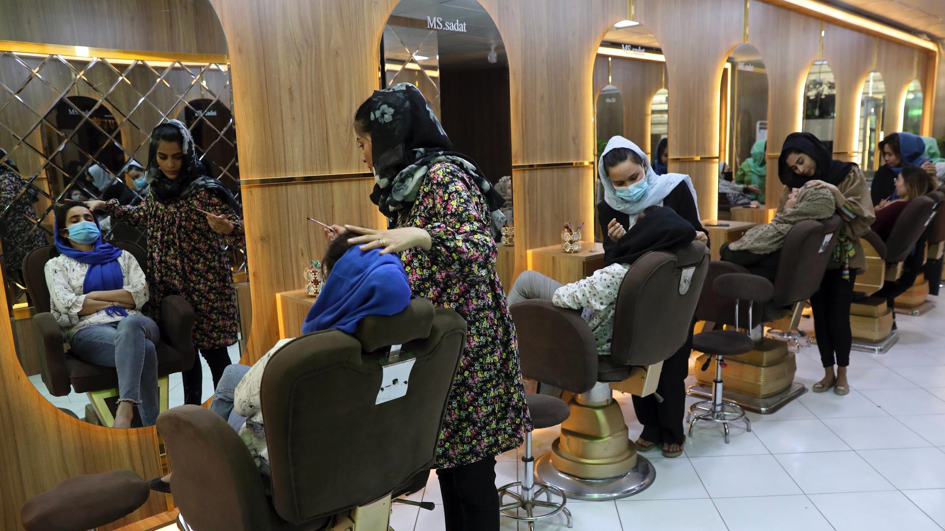 Women providing services within a beauty salon