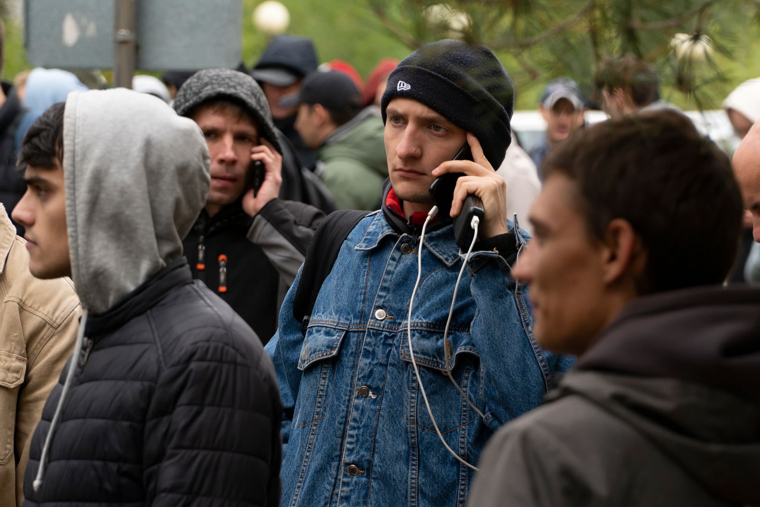 Russians, mostly men, lineup to get a Kazakh registration after crossing the border into Kazakhstan from the Mariinsky border crossing, about 250 miles south of Chelyabinsk, in Russia, to Kazakhstan's town of Uralsk, Wednesday, Sept. 28, 2022.