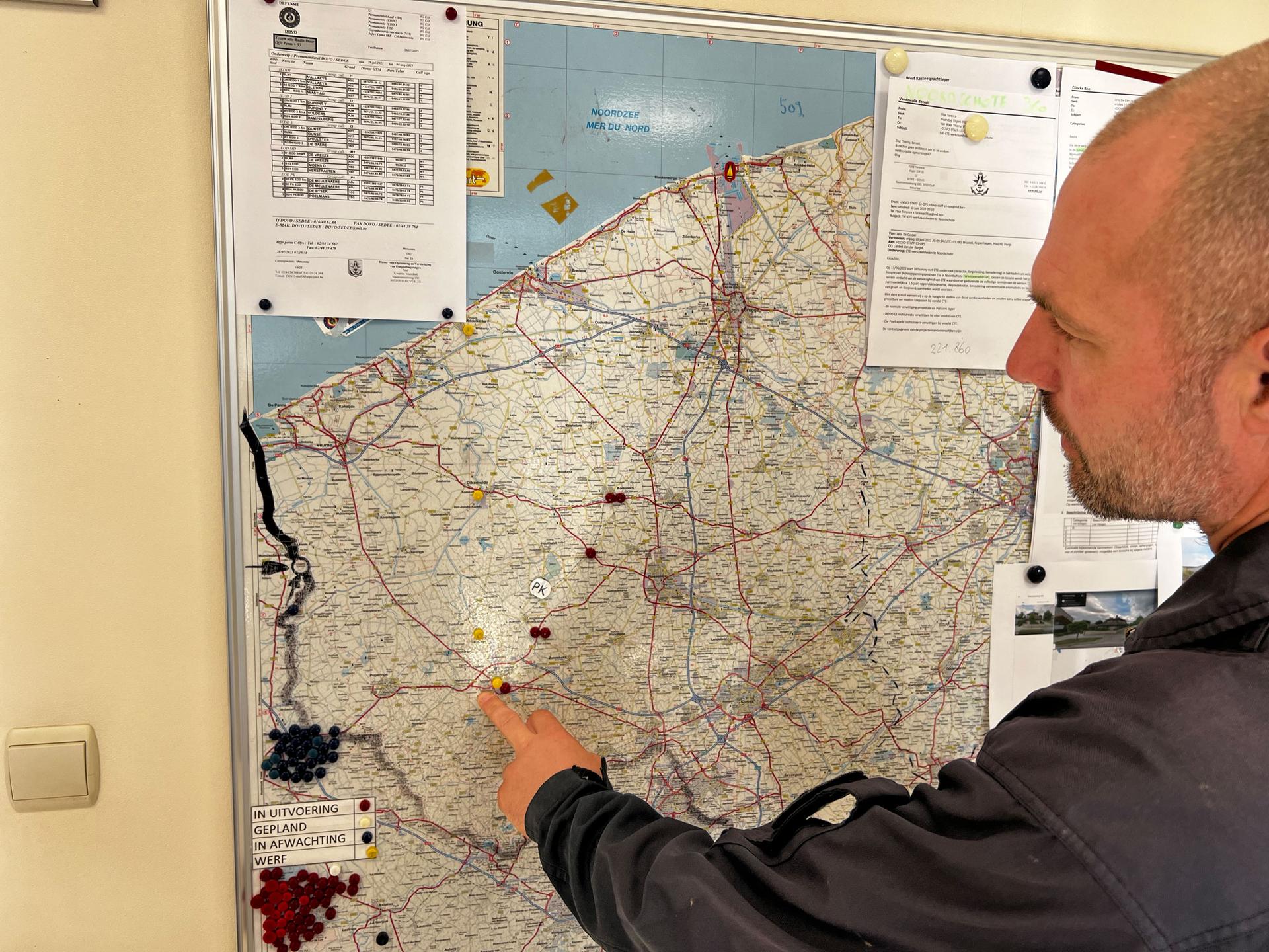 At the Belgian bomb squads barracks in Poelkapelle, Belgium, Warrant Officer Steven de Meulenaere points out the six sites his unit is tasked with clearing of unexploded ordnance on Aug. 1, 2023. On average, the team will get more than 10 assignments each