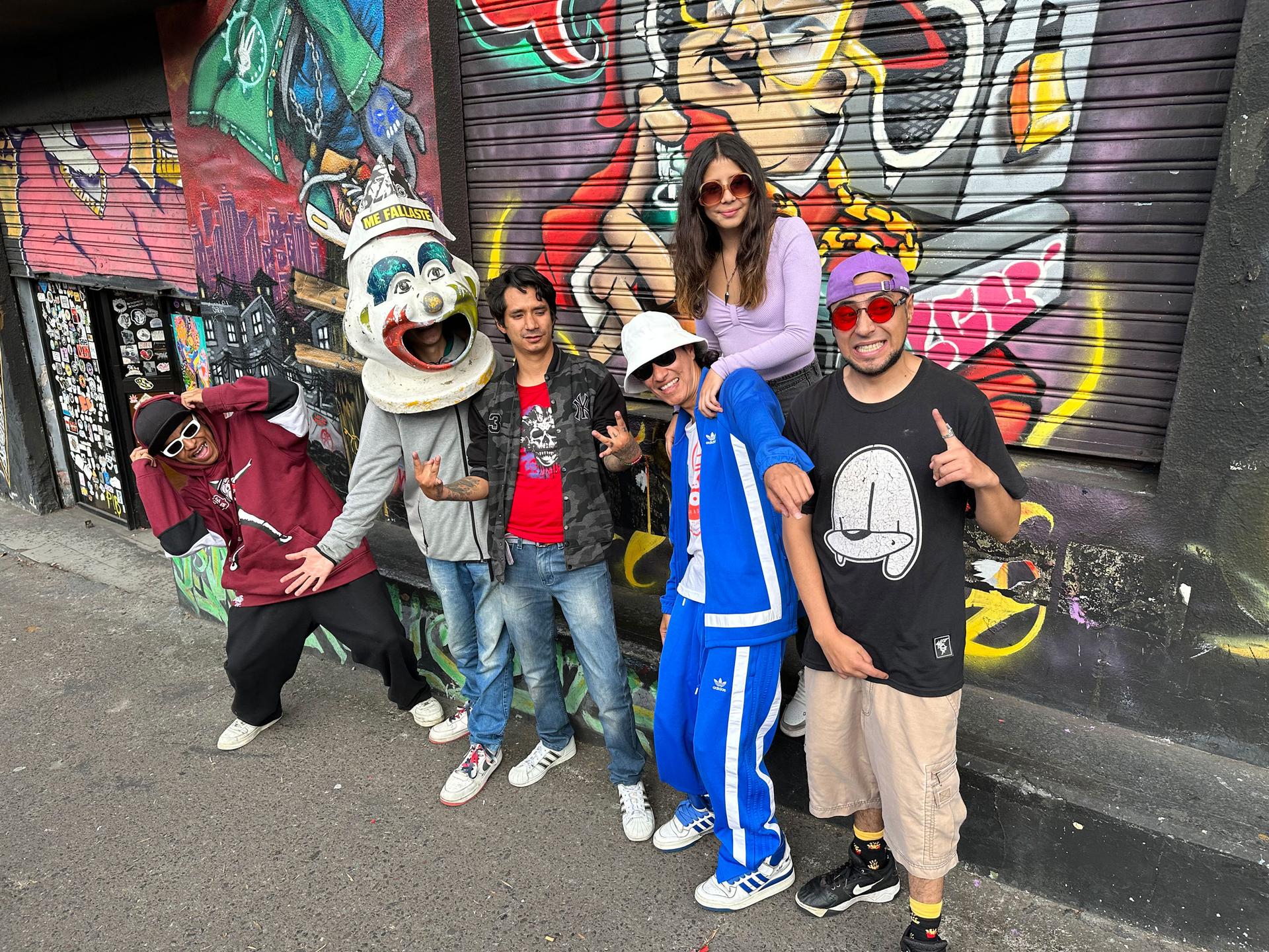 Paul Moposita (wearing blue tracksuit), his daughter Sisa and some of the members of Mugre Sur, a band he started more than 20 years ago.