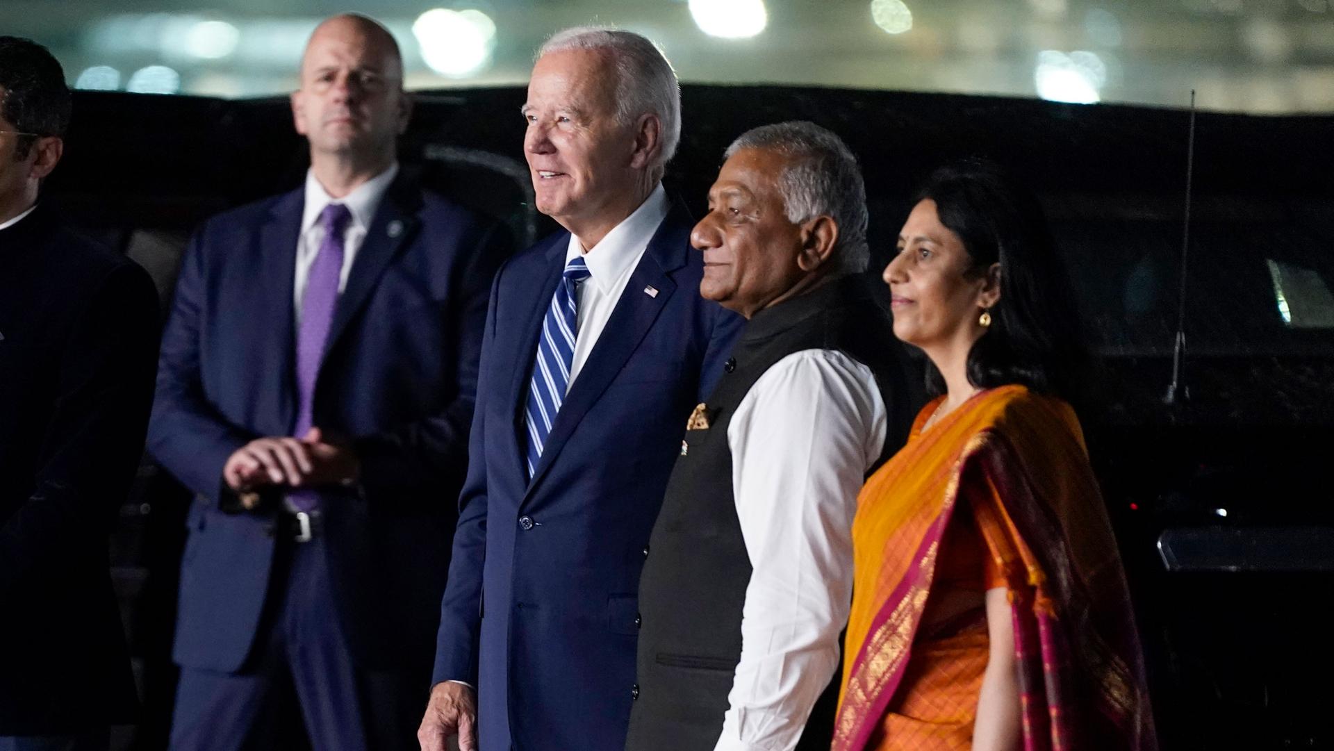 President Joe Biden watches a group of dancers alongside other leaders in India at night 