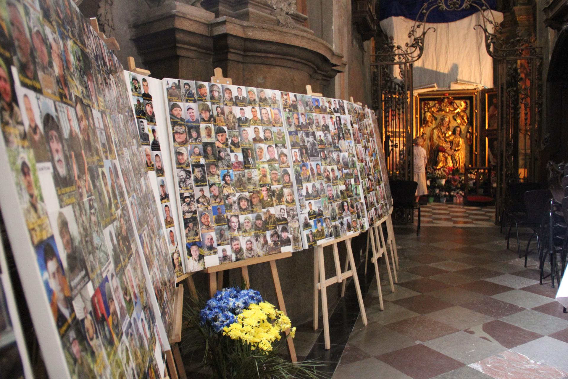 Since 2014, rows and rows of photographs of fallen soldiers have been added to a display within Saints Peter and Paul Garrison Church.
