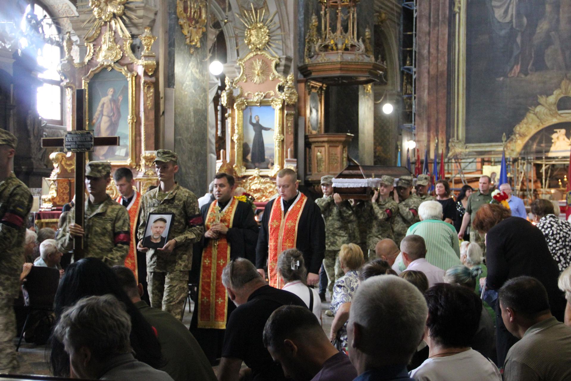 At Saints Peter and Paul Garrison Church, the morning service is followed by a funeral for fallen Ukrainian soldier, Lviv, Ukraine.