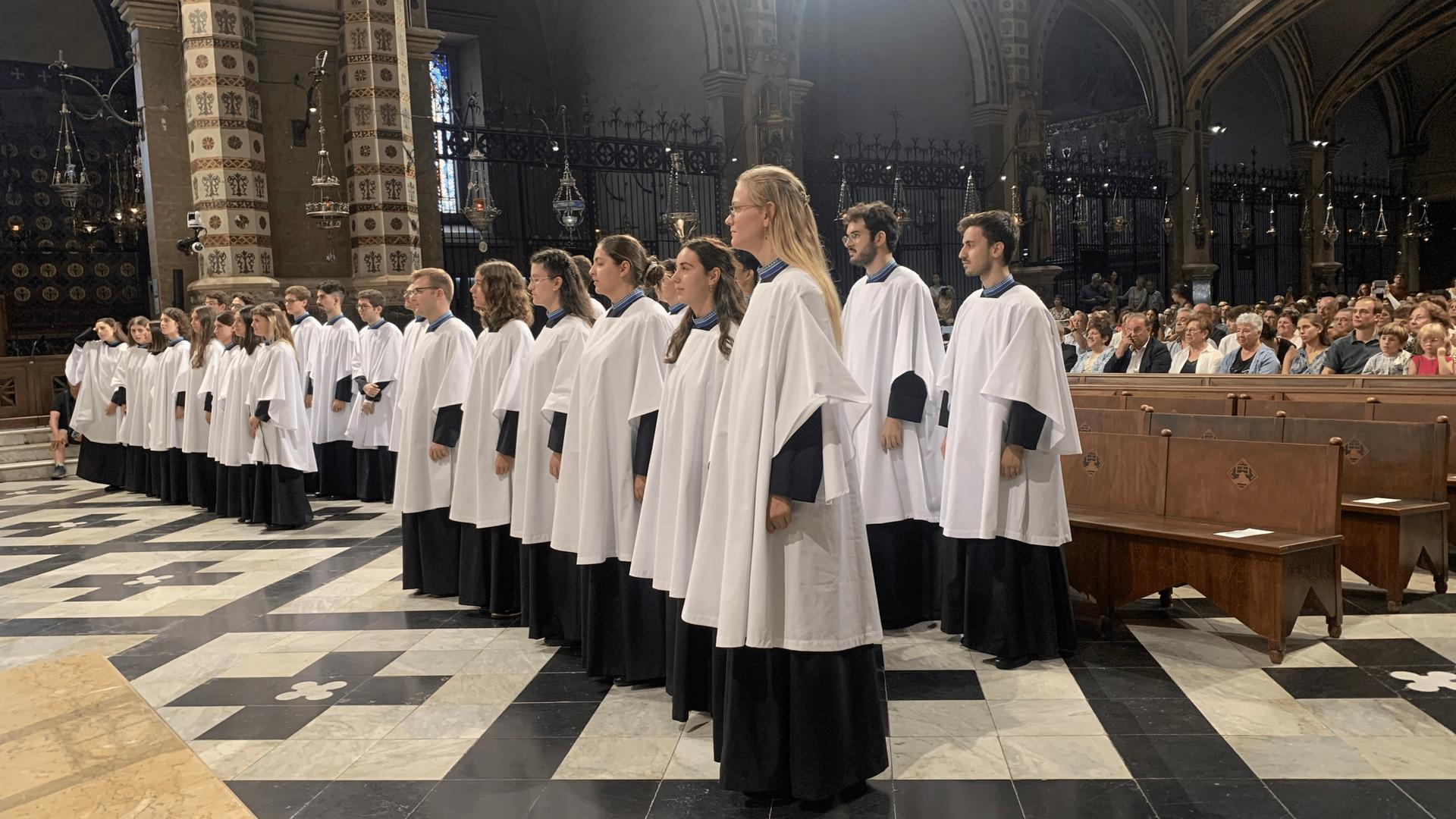 Montserrat Abbey’s mixed Escoliana choir has young women and men. They’ll sing the liturgy one weekend a month, so that the regular all-boys choir can have some time off with family.