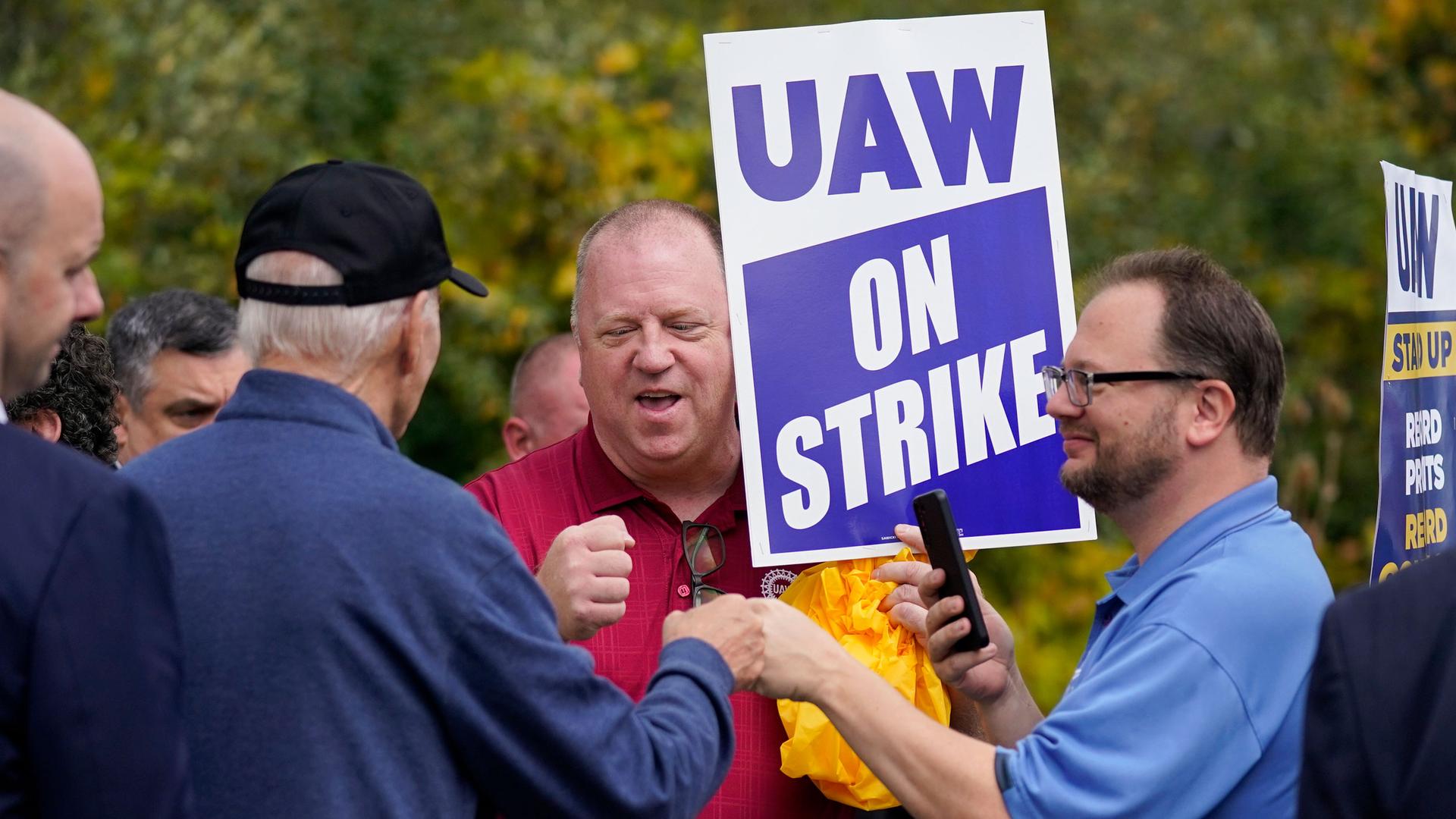 President Joe Biden greets striking United Auto Workers on the picket line, Tuesday, Sept. 26, 2023, in Van Buren Township, Michigan. 