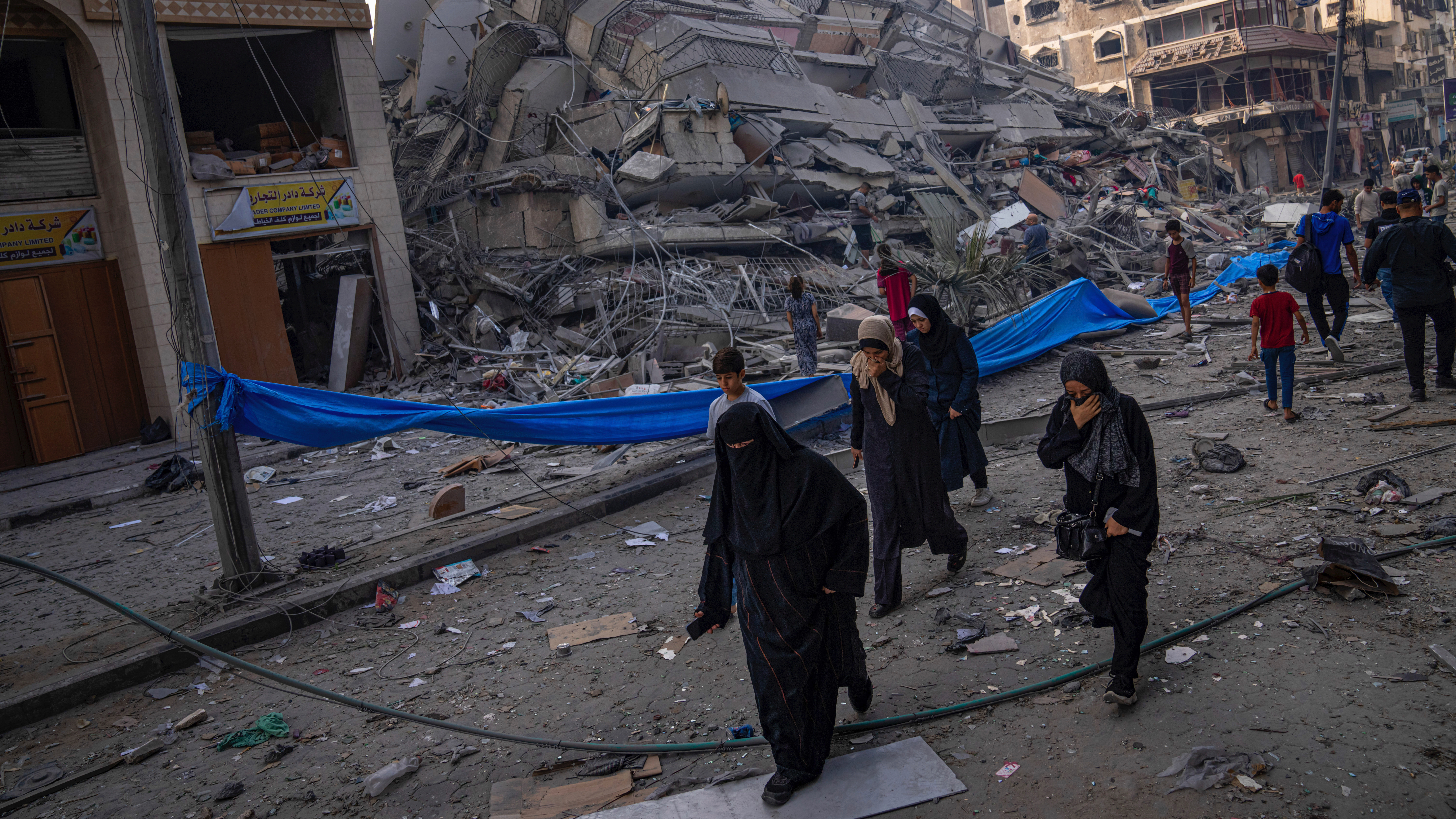 people amid rubble