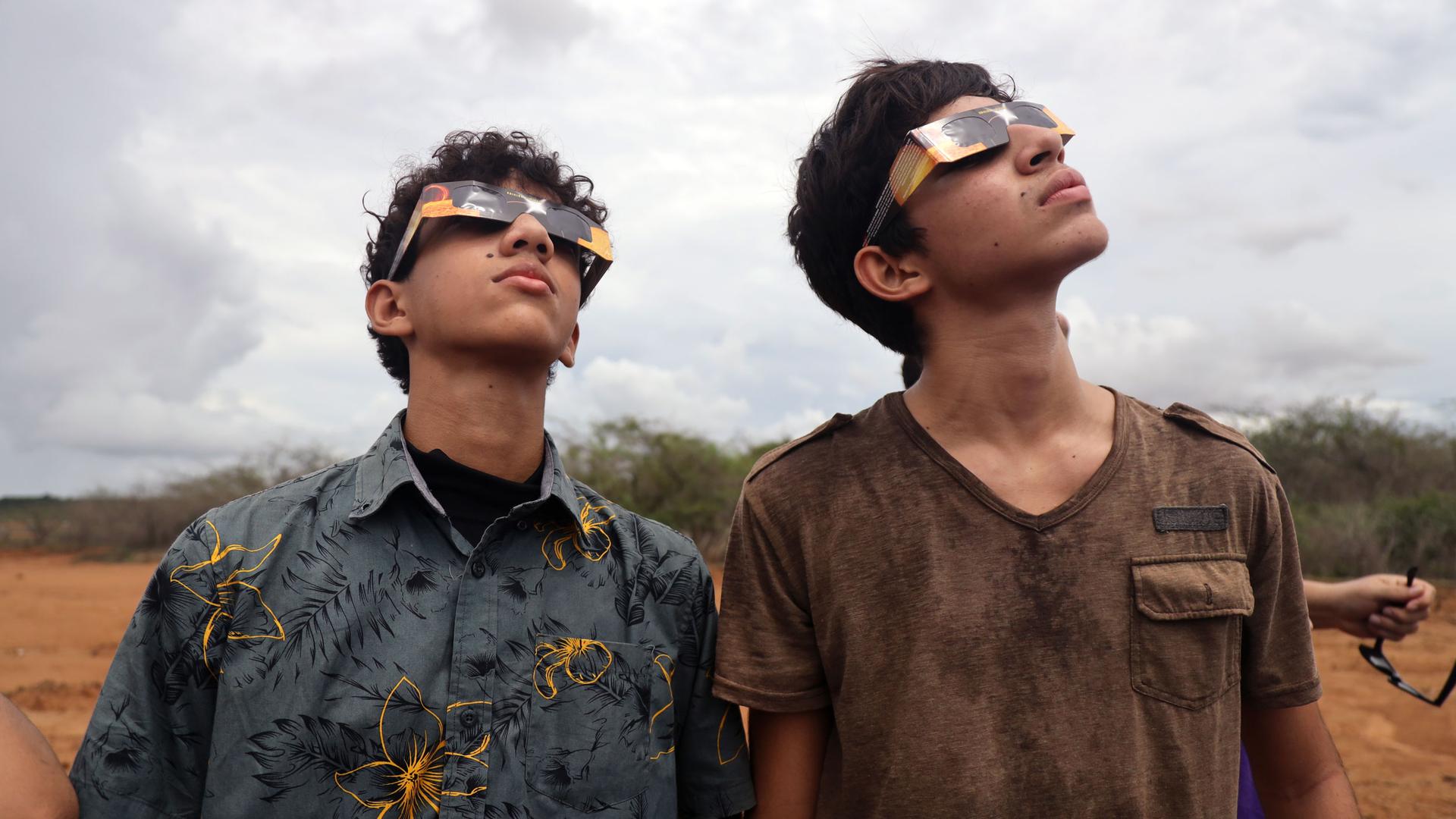 Two young Panamanians view the solar eclipse. 