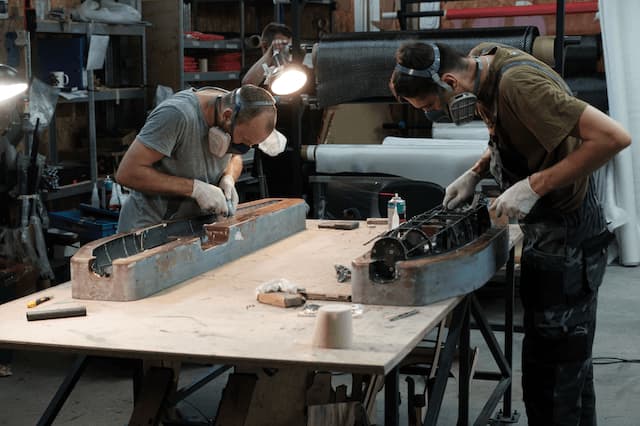 two men working on molds
