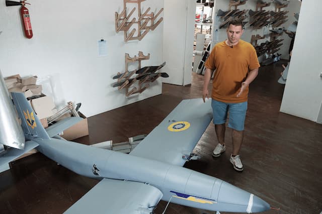 man standing near drone design