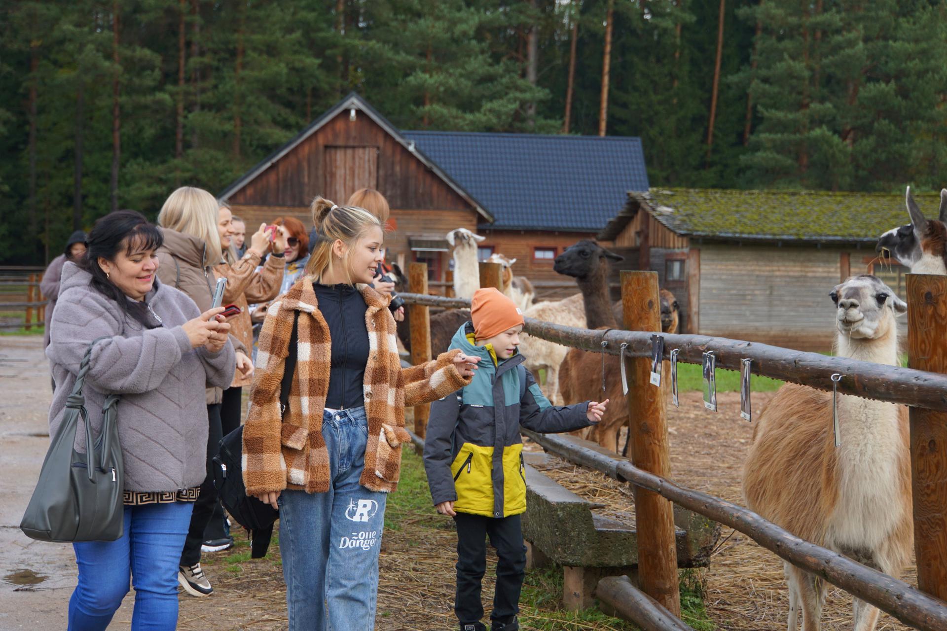 Ukrainian families spend the day at a petting zoo in Riga, the Latvian capital.