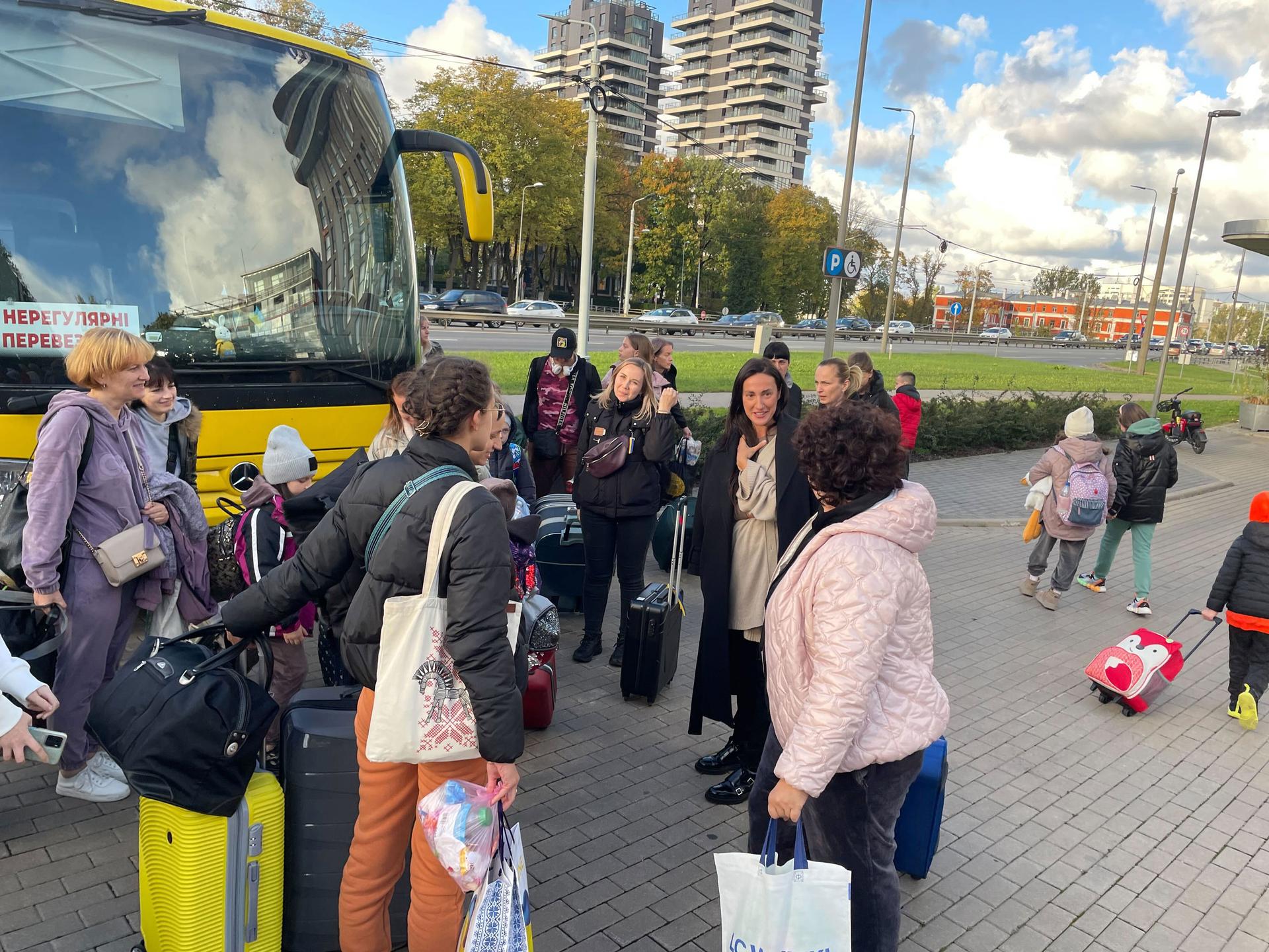 Diana Klimcenko, with the Children’s Hospital Foundation, meets a new group of families after a 30-hour bus ride from Ukraine to Latvia.