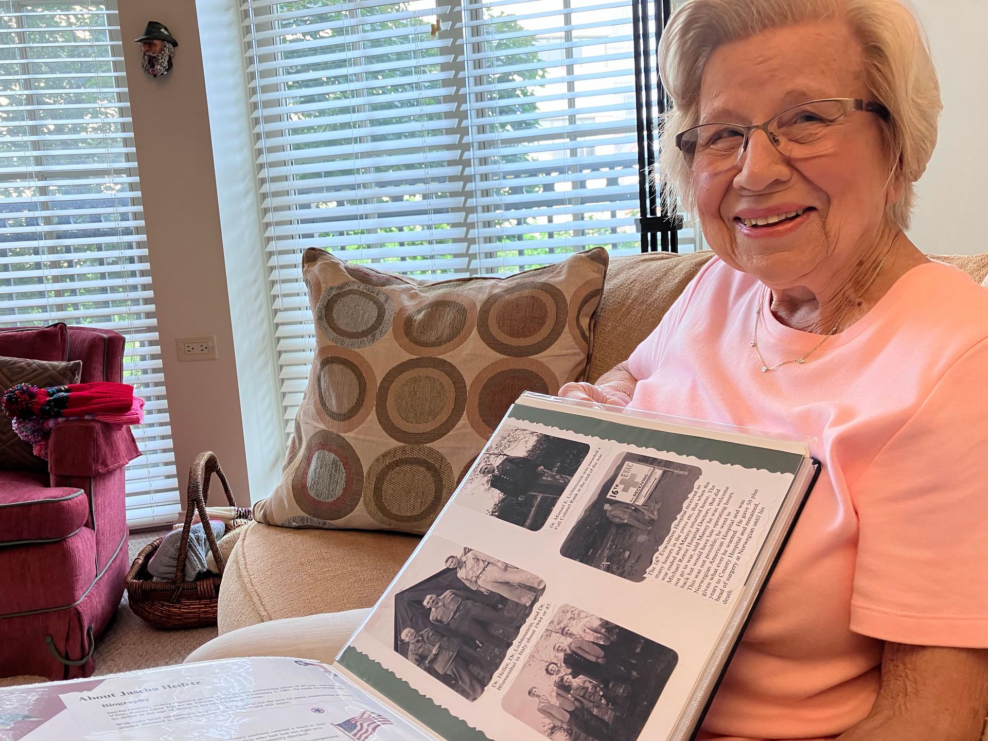 Fran Lichtenstein, now 92, recalls memories of her father-in-law, Manuel E. Lichtenstein, and holds her ancestry archives in her lap, Evanston, Illinois, July 2023.