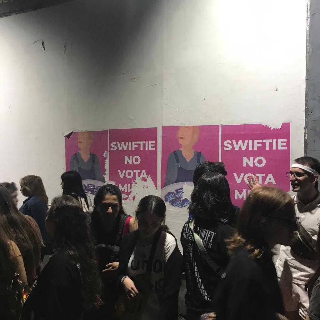Pink posters with the caption: 