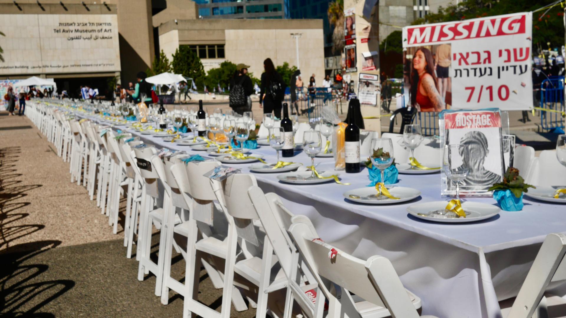 An empty shabbat table is set in front of the Tel Aviv Museum to symbolize over 200 missing Israeli hostages taken by Hamas on Oct. 7, 2023.