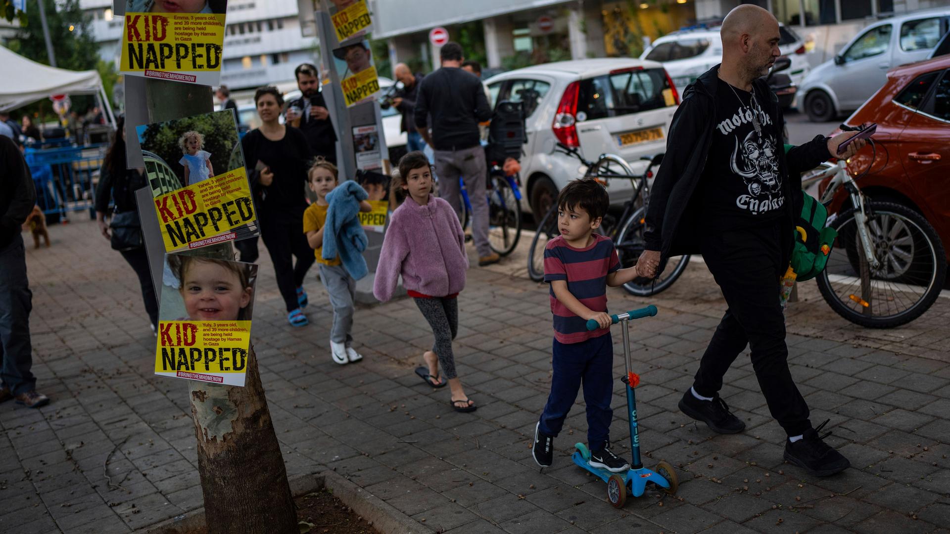People gather for a protest calling for the return of 40 children who are among the roughly 240 hostages believed held by Hamas militants in the Gaza Strip and to mark World Children's Day, across from UNICEF offices in Tel Aviv, Israel, Monday, Nov. 20, 