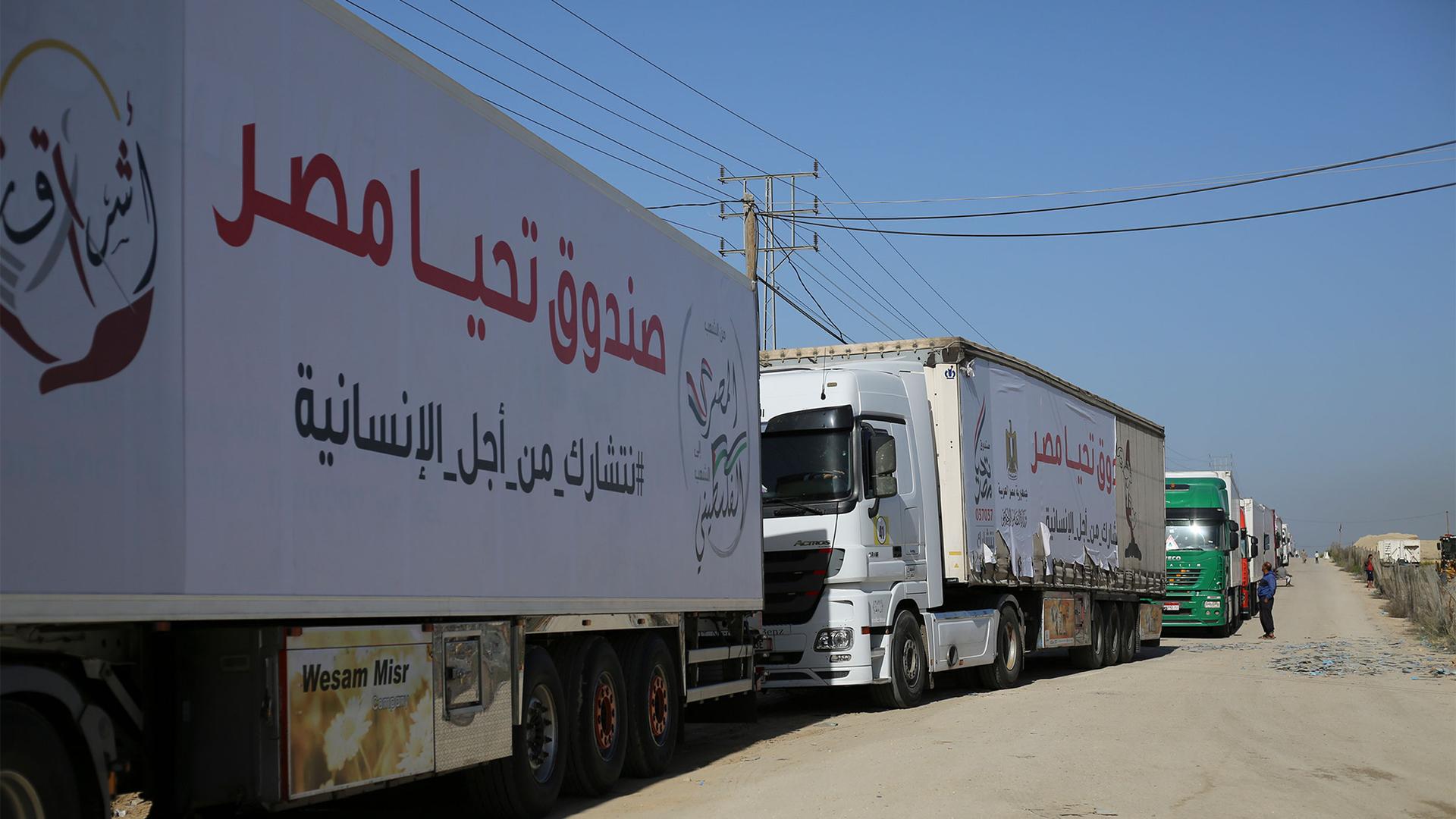 Trucks carrying humanitarian aid enter Gaza Strip from Egypt in Rafah as a temporary ceasefire went into effect, Nov. 24, 2023.