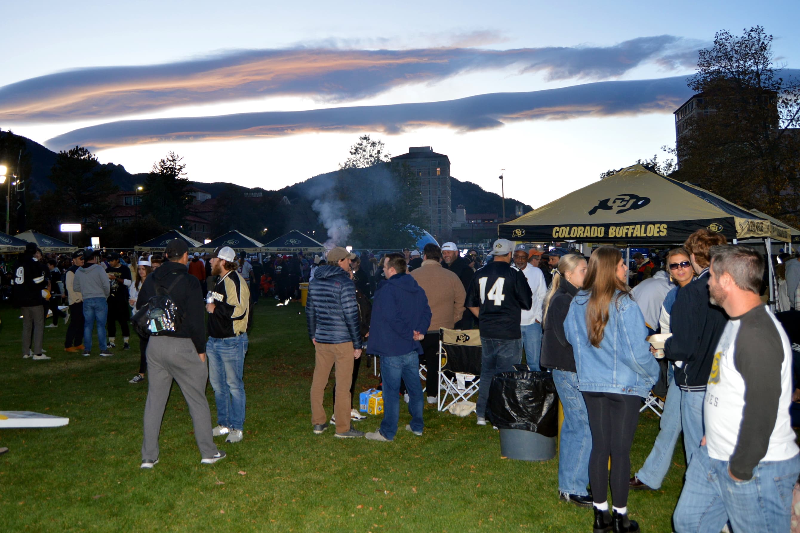 Crowd of people wearing jerseys for a football tailgate