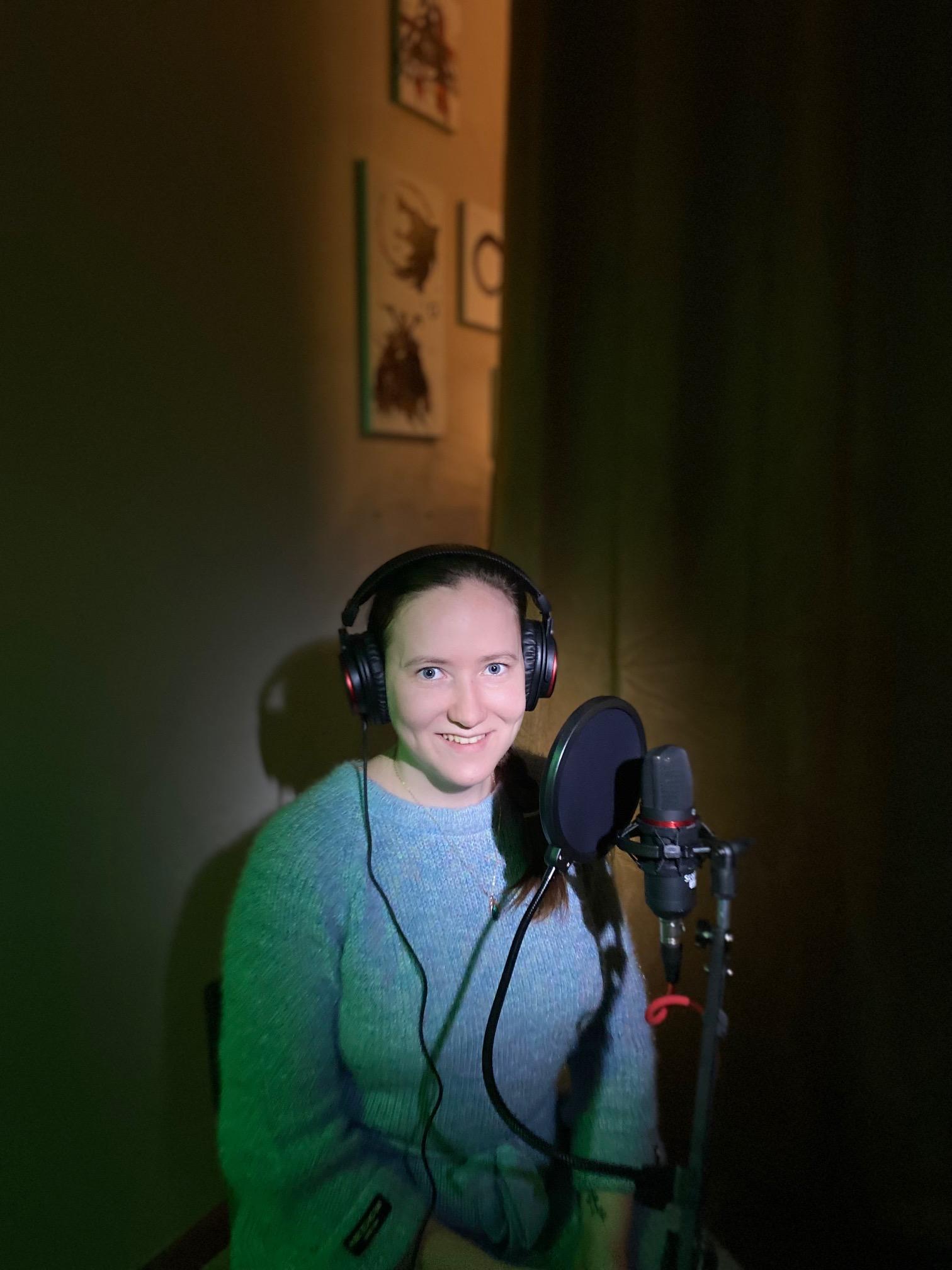 Woman behind a podcast mic
