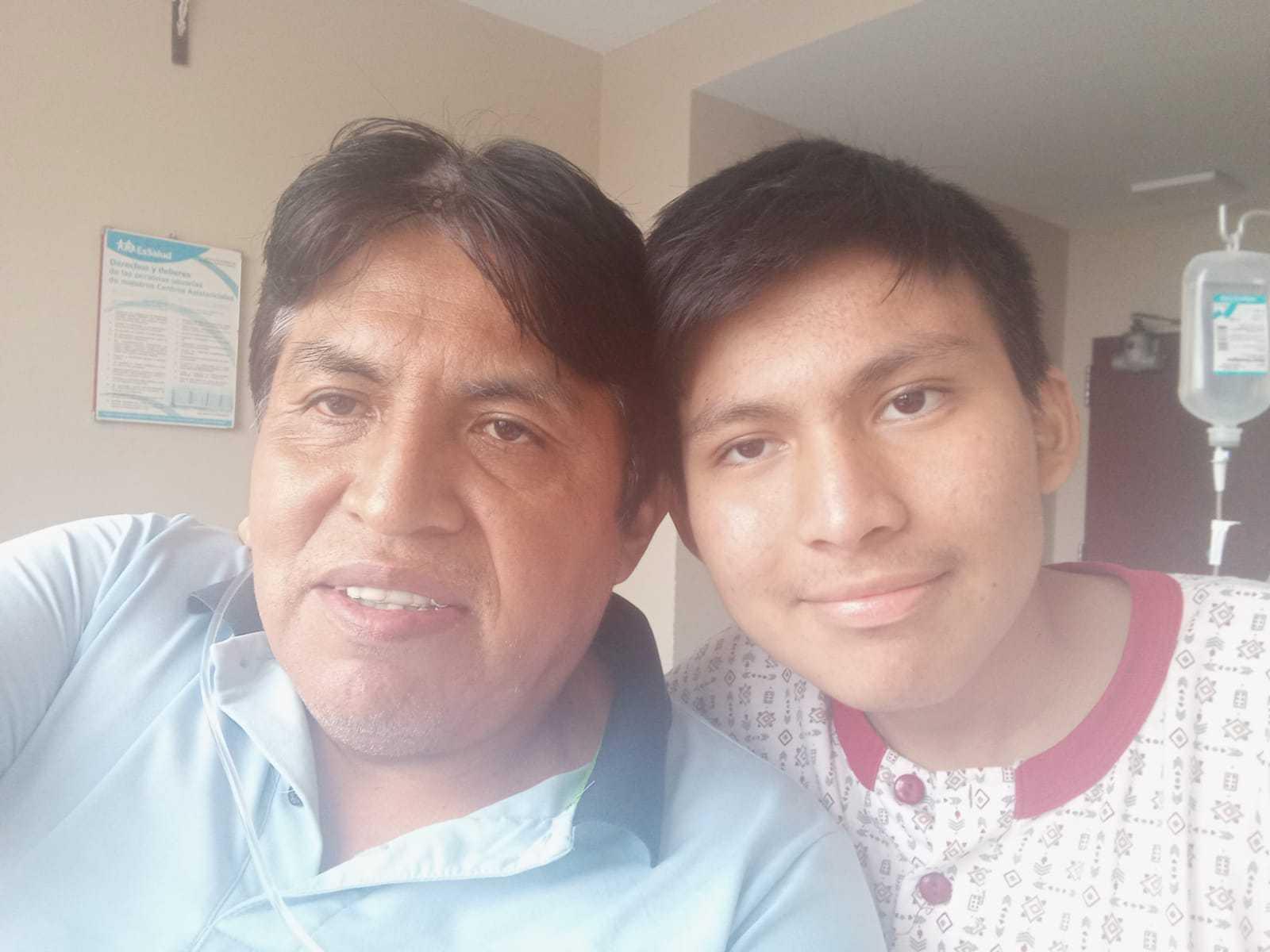 Estefano Carrión and his father, Johny, on a recent morning at the hospital Edgardo Rebagliati in Lima, Peru.