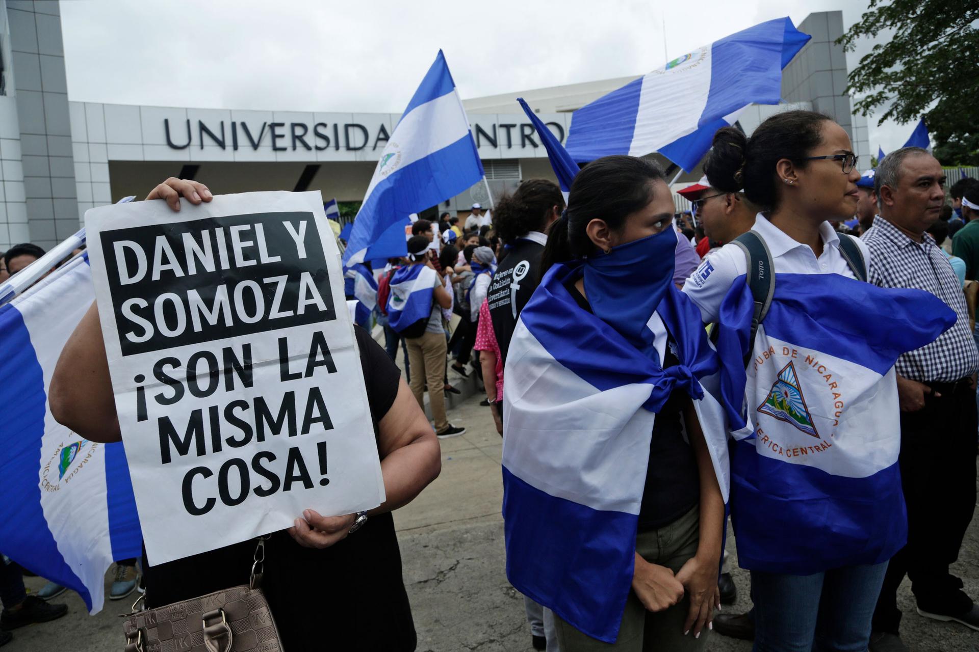 Demonstrators protest outside the Jesuit-run Universidad Centroamericana, UCA, demanding the university's allocation of its share of 6% of the national budget in Managua, Nicaragua, Aug. 2, 2018.
