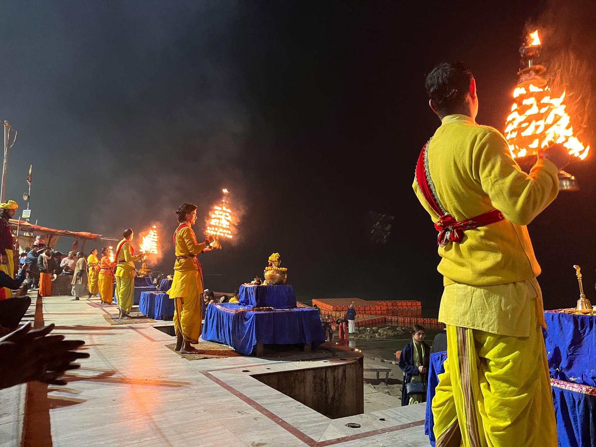 Hindu priests conduct evening prayers on the banks of the Saryu river in Ayodhya where a new Hindu temple has replaced a 16th-century mosque demolished by Hindu nationalists in 1992.