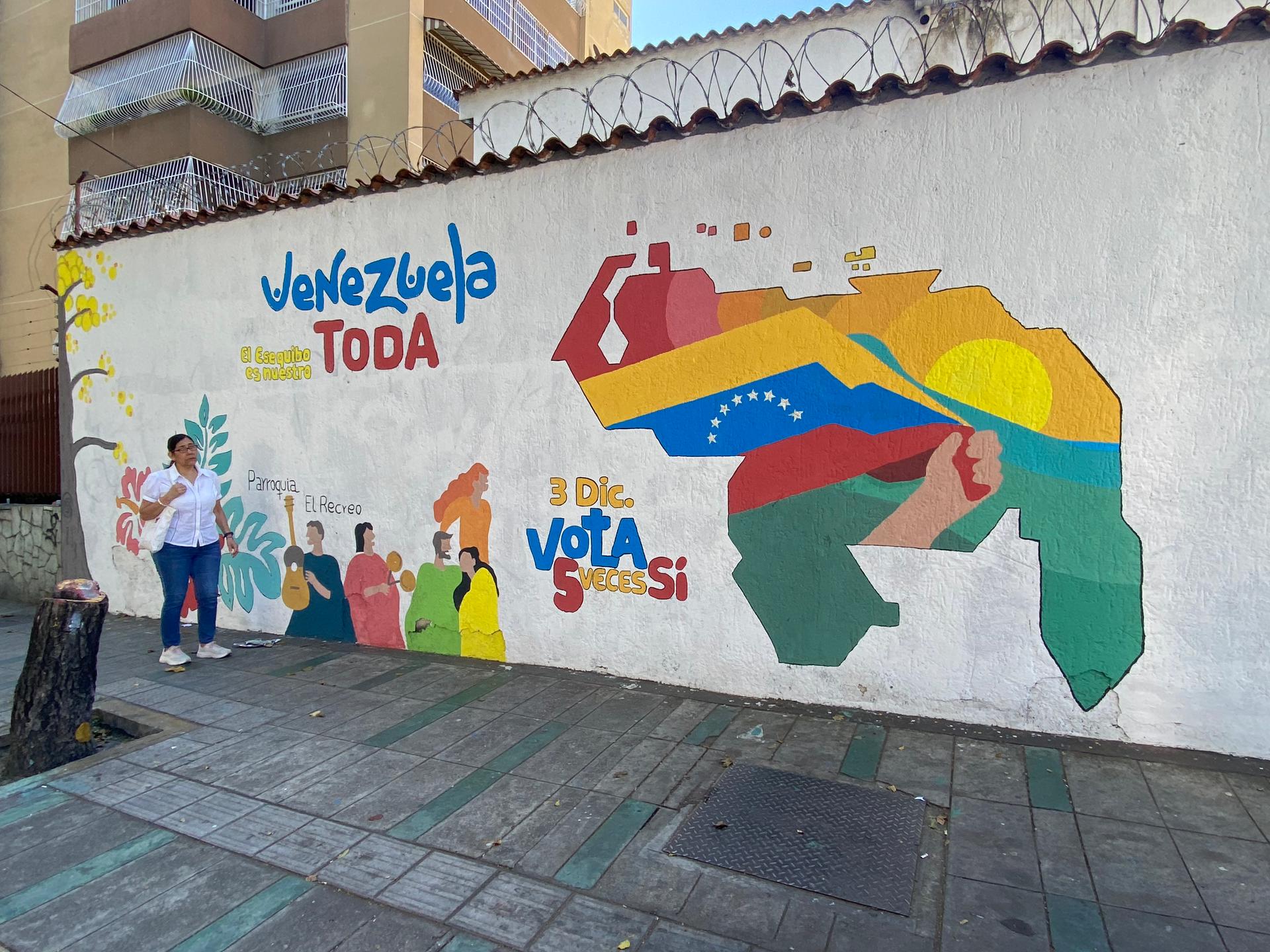 A colorful mural in Caracas depicts a map of Venezuela that includes the disputed Essequibo region. It's the long strip of land to the right of the rising sun.