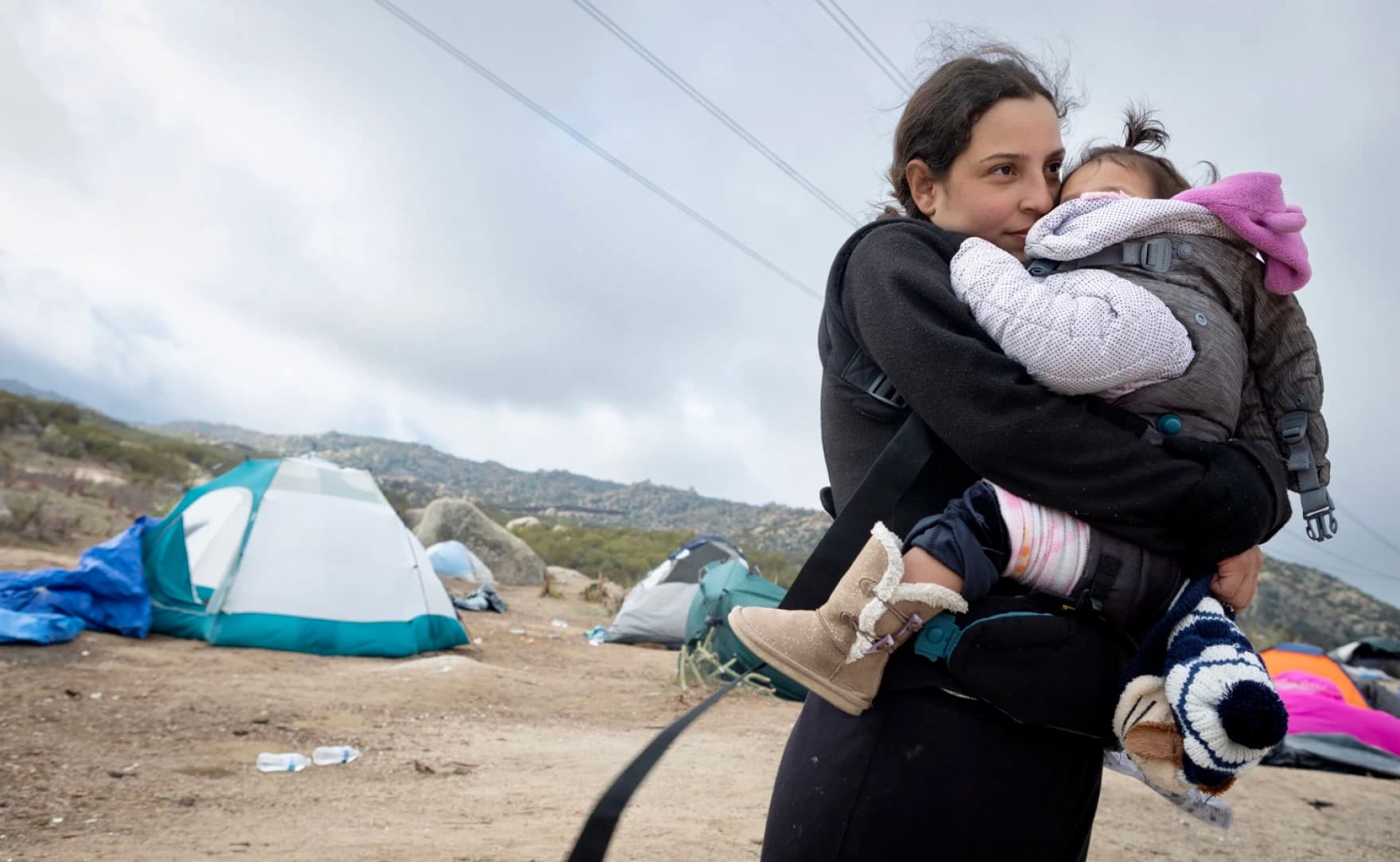 A woman holding a child