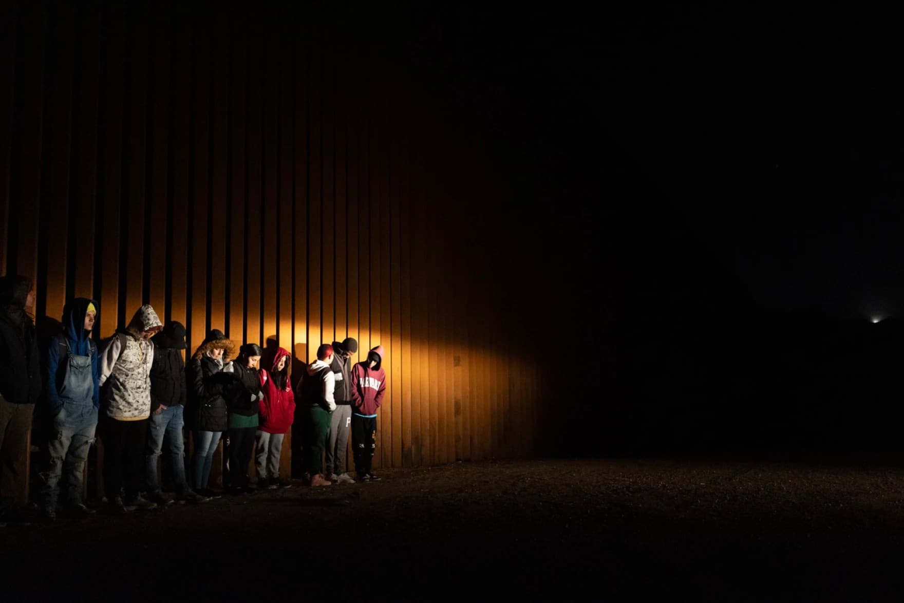 Migrants wait to be processed by immigration authorities near Boulevard.