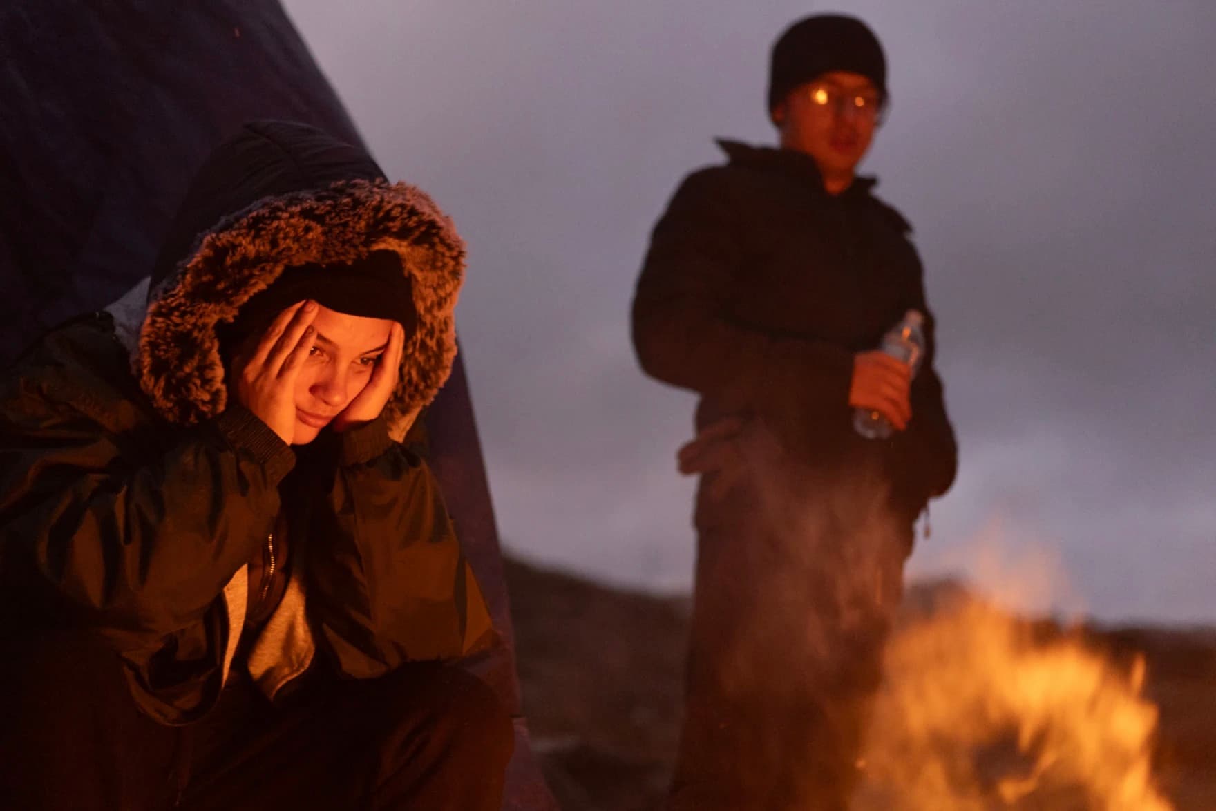 Migrants from Brazil try to stay warm by a fire near Jacumba Hot Springs.