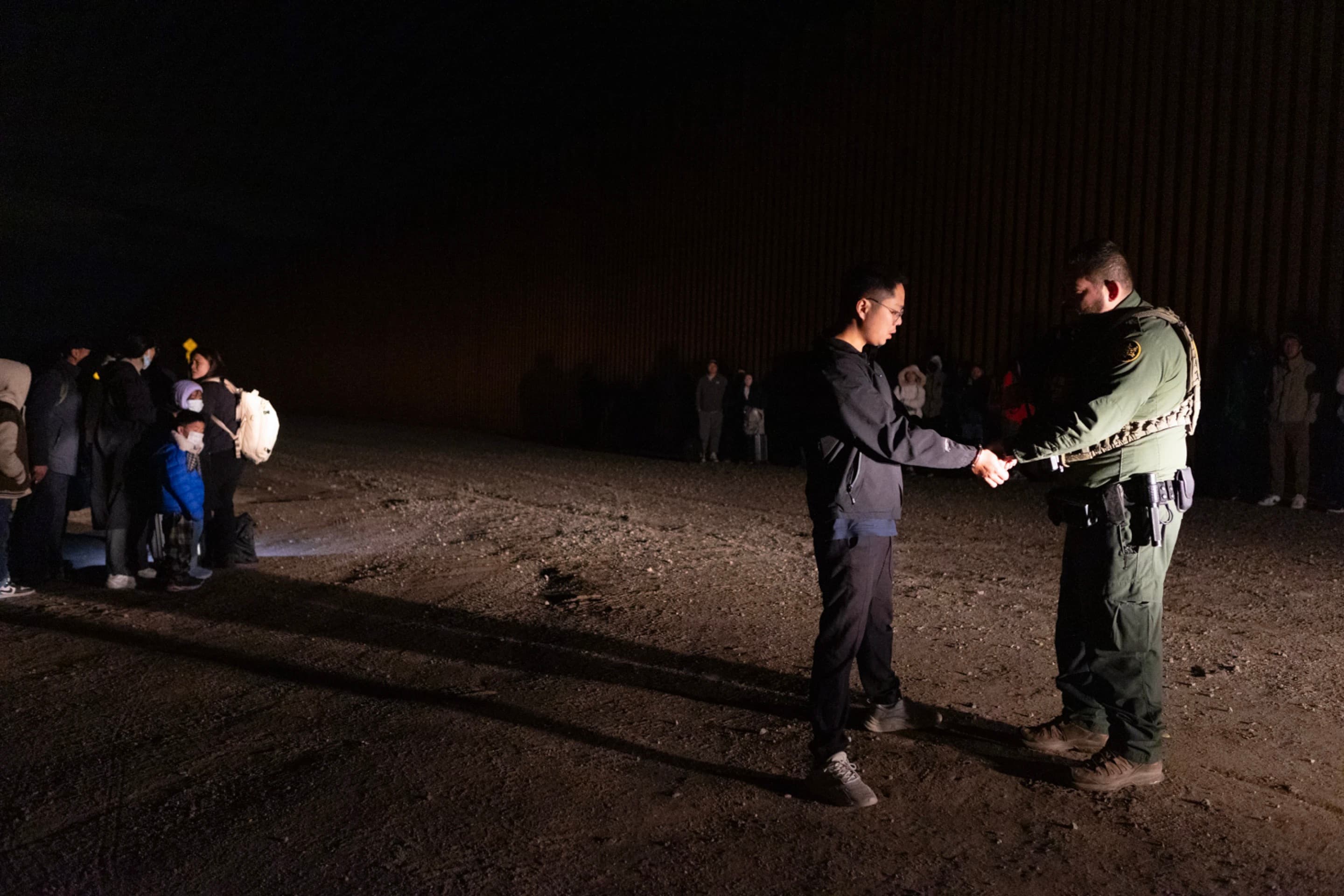 Two men standing and talking