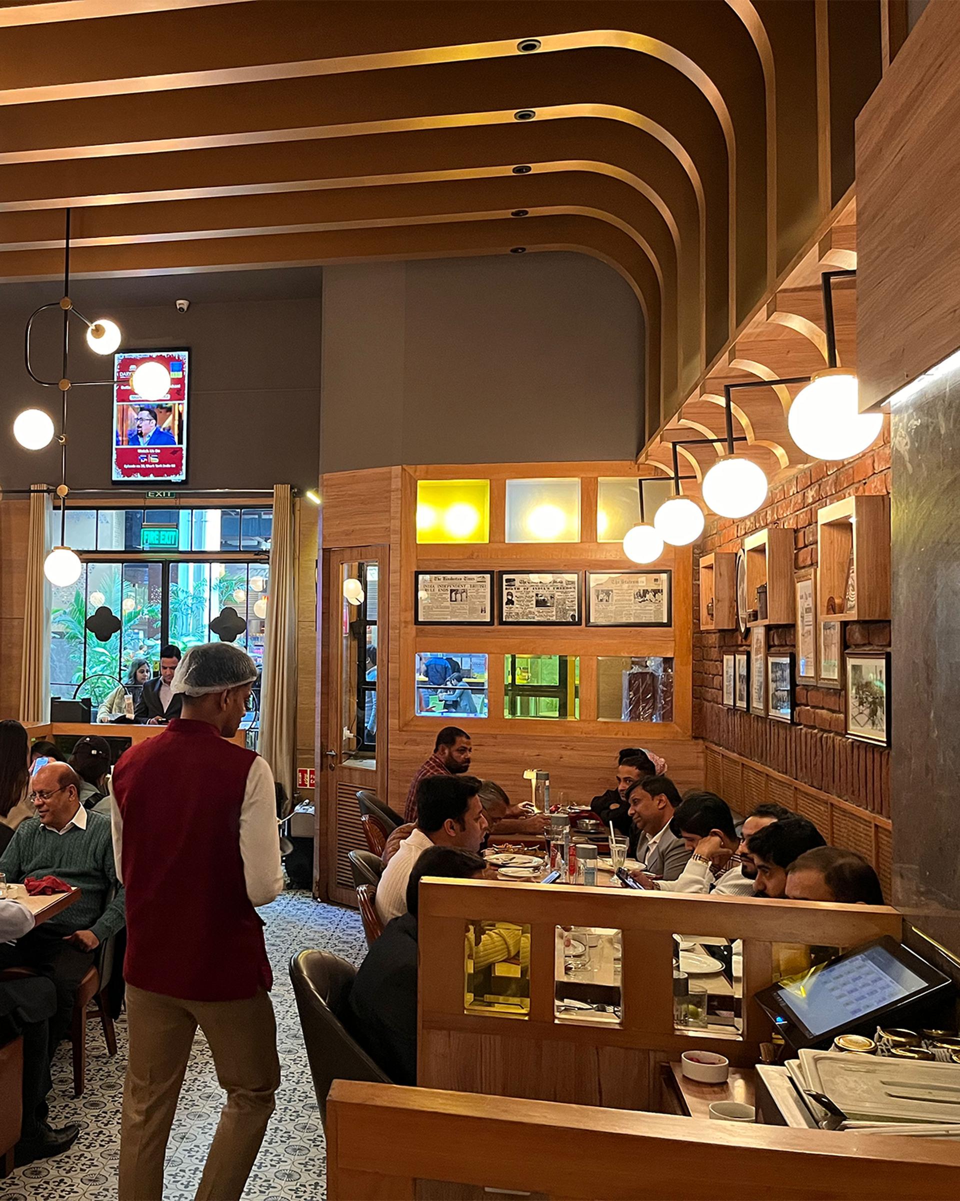 Customers are served lunch at the Daryaganj restaurant. It claims to own the original butter chicken recipe, but has been sued for copyright infringement by a rival Delhi restaurant.