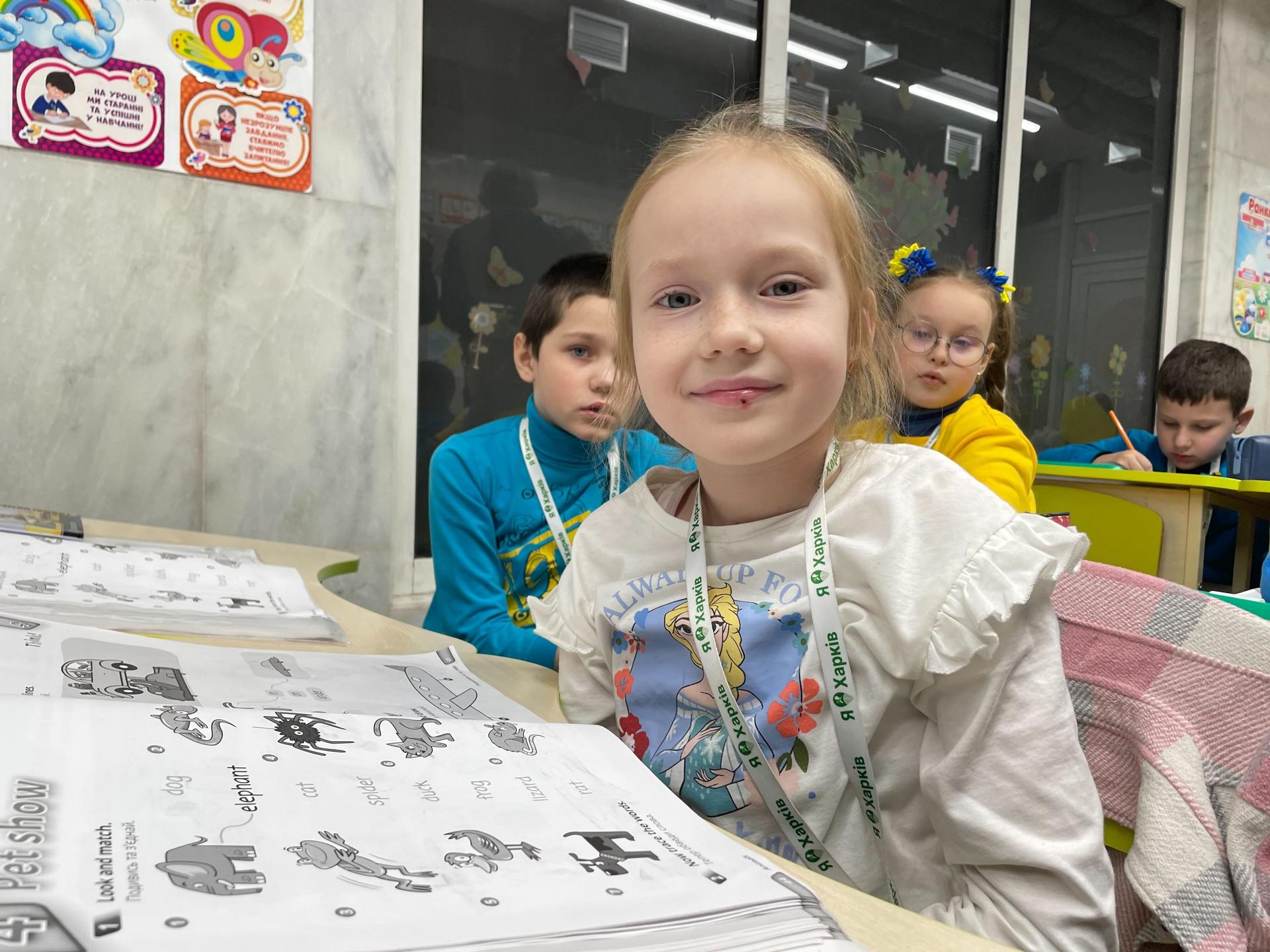 Katya Rybalka smiles as she attends an English language class in the Kharkiv metro underground.
