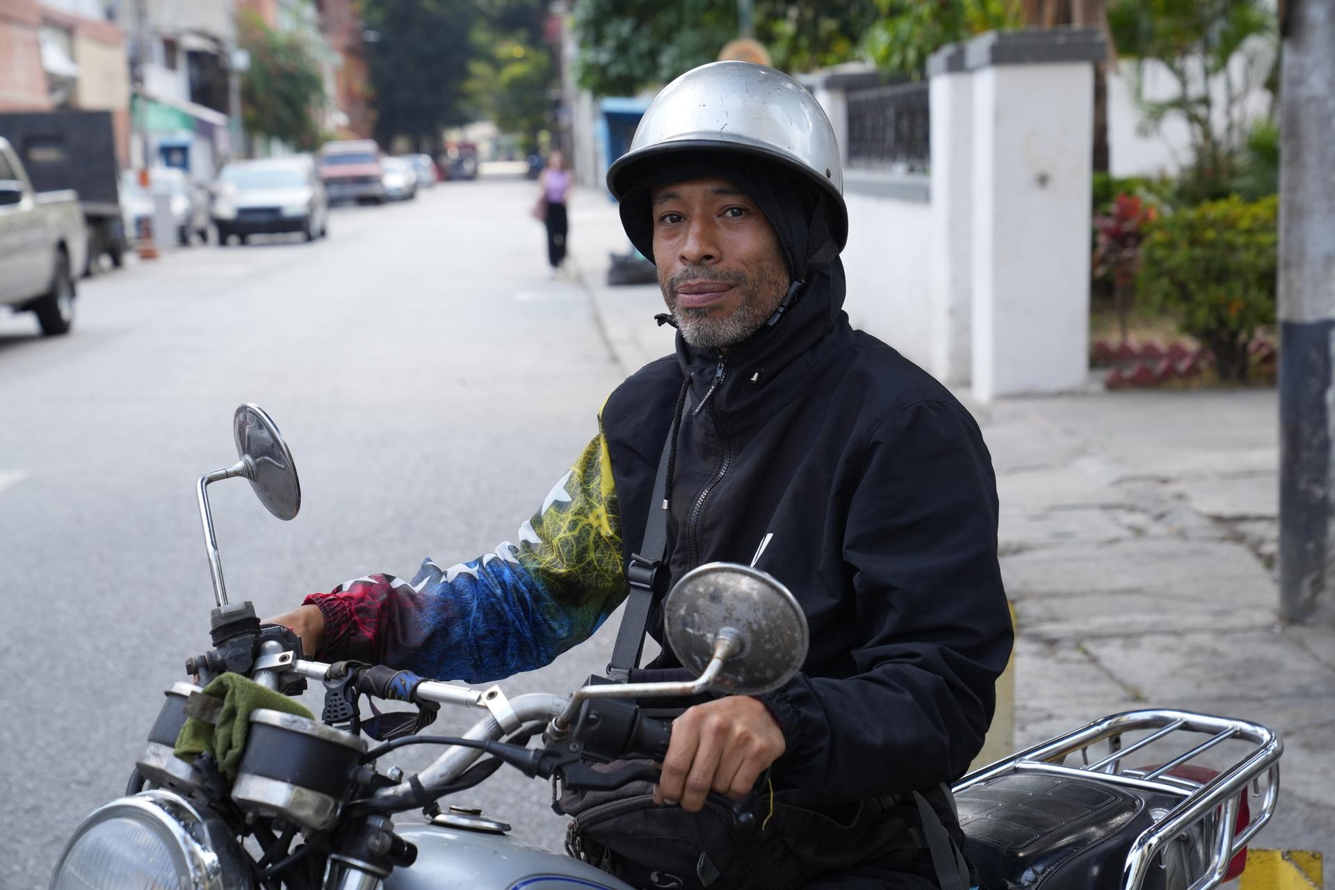 When he's not with his students, P.E. teacher Yasser Sierra uses his old bike to transport people and make deliveries.