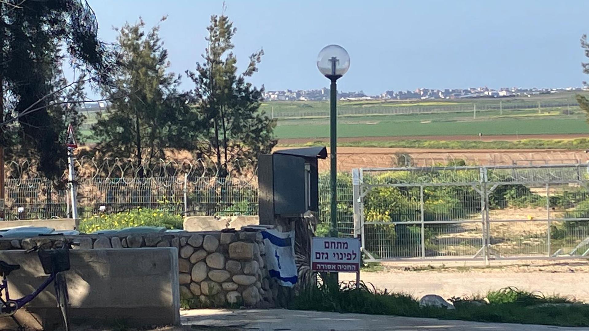 Hamas militants barricaded the fence on the early morning Oct. 7, killing 63 of Kibbutz Kfar Aza's 970 residents. Northern Gaza, seen in the distance, is only a mile away from the kibbutz.