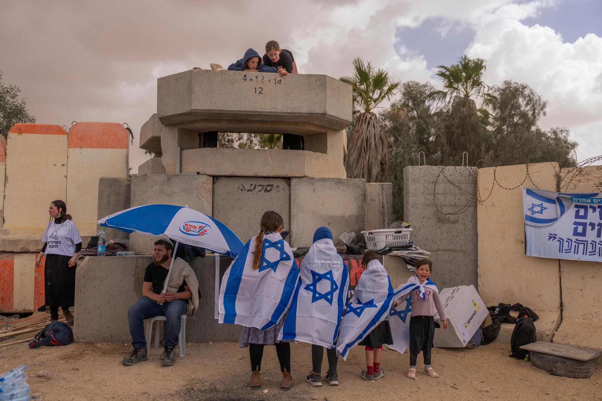 People gather at Israel's Nitzana border crossing with Egypt in southern Israel protesting against the delivery of humanitarian aid to the Gaza Strip until all hostages held by Hamas militants are released, Feb. 27, 2024.