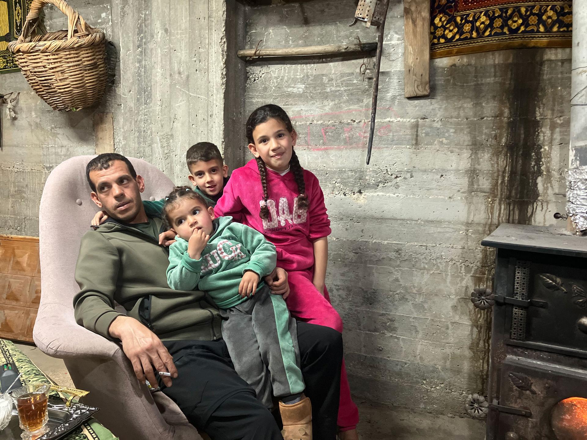 Mousa Abd Razzak with his three children.
