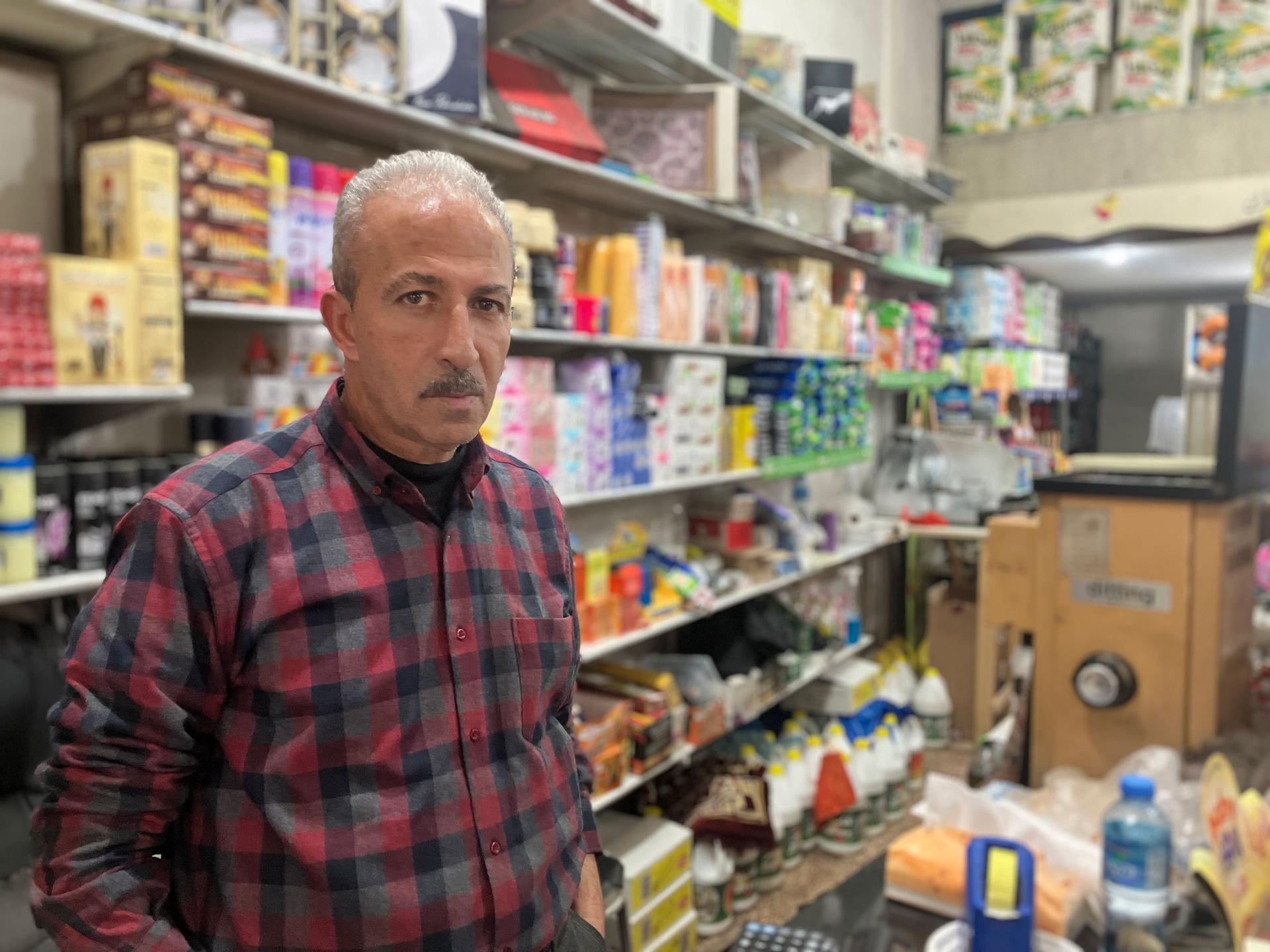 Nasser Khalil, owner of a corner shop in Ein 'Arik who says dozens of his customers have been buying on credit.