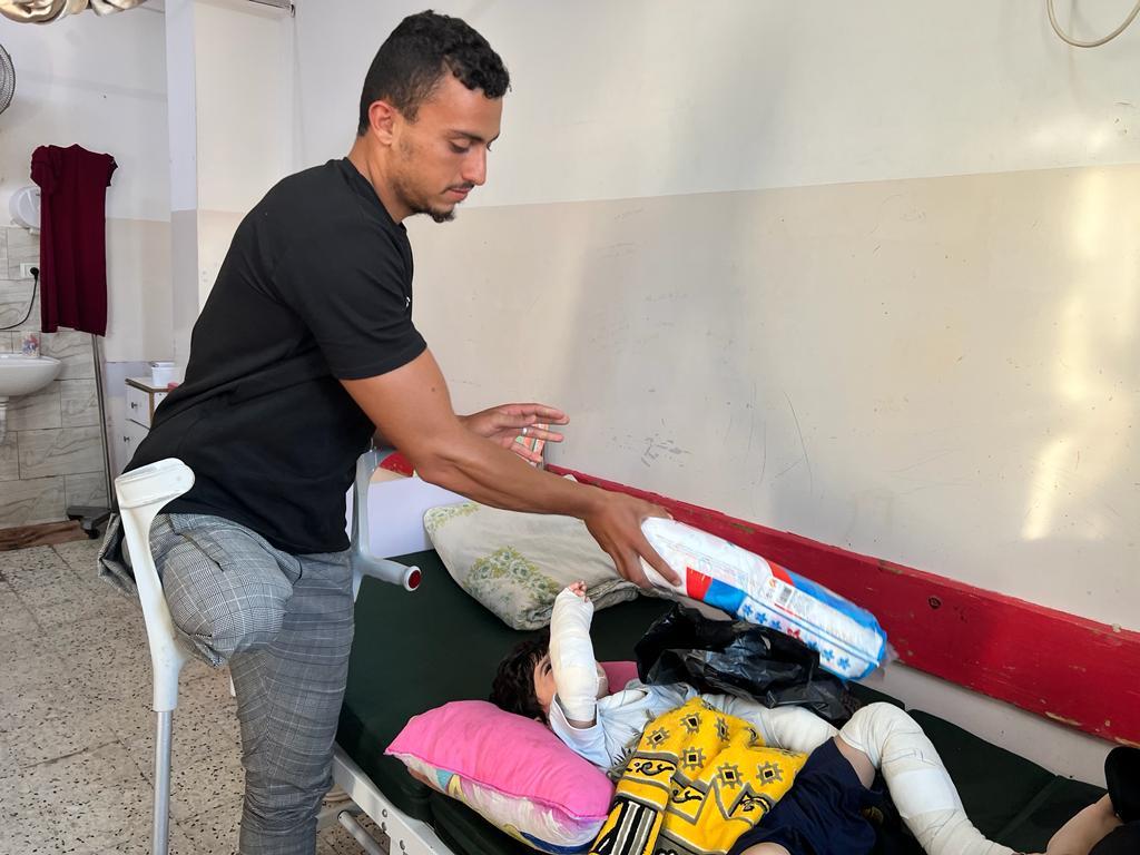 Mohammed Abu Asfour, a member of the Gaza Sunbirds, delivers a baby package as part of their aid efforts in Gaza.