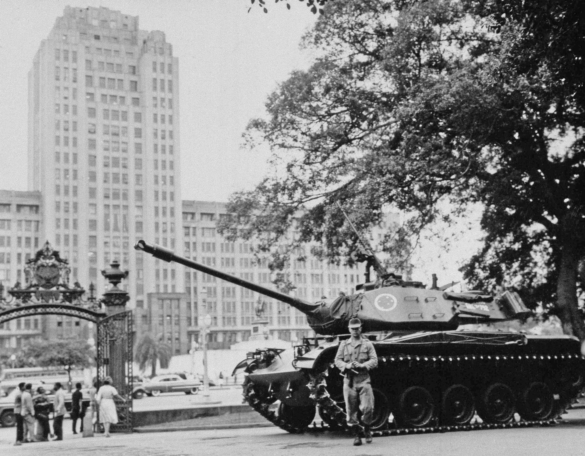 A tank stands guard in front of War Ministry in Rio de Janeiro. Army was put on alert Oct. 2. 1963.