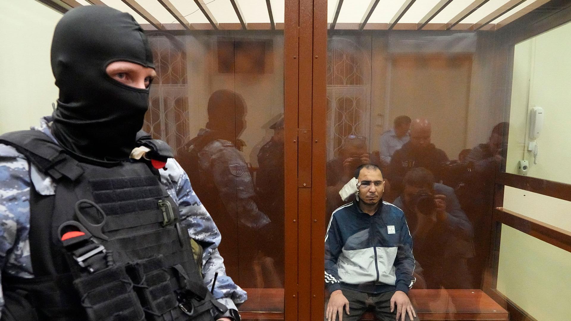 Saidakrami Murodali Rachabalizoda, a suspect in the Crocus City Hall shooting, sits in a defendants’ cage in Basmanny District Court in Moscow, Russia, on March 24, 2024.