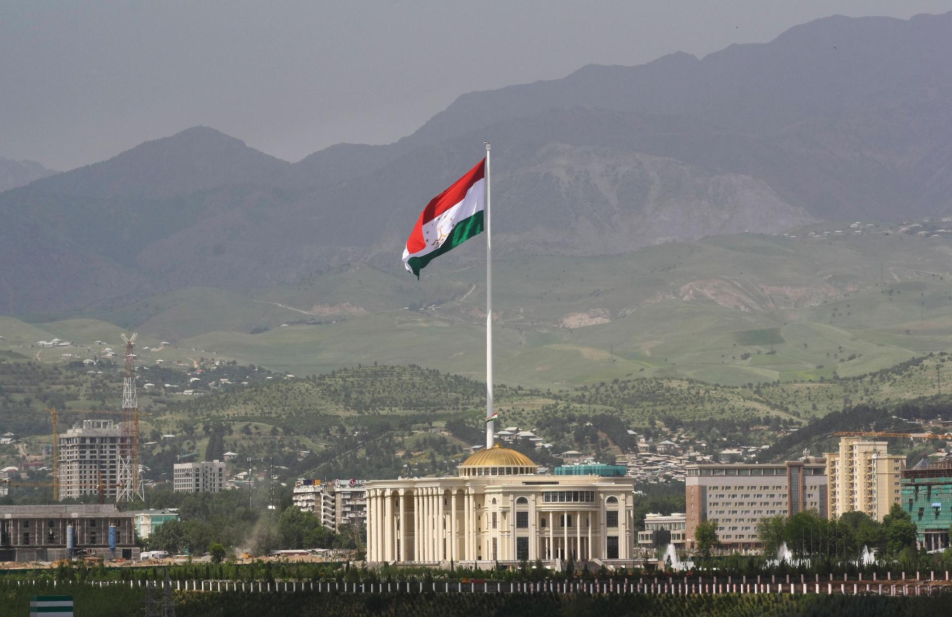 A national flag of Tajikistan is hoisted to the top of the flagpole in Dushanbe, Tajikistan, Tuesday, May 24, 2011.