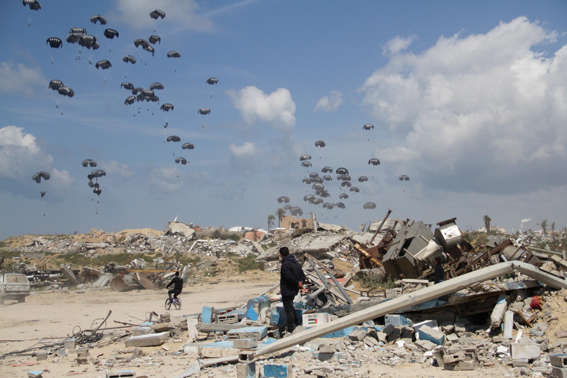 Humanitarian aid is airdropped to Palestinians over Gaza City, Gaza Strip on March 25, 2024.
