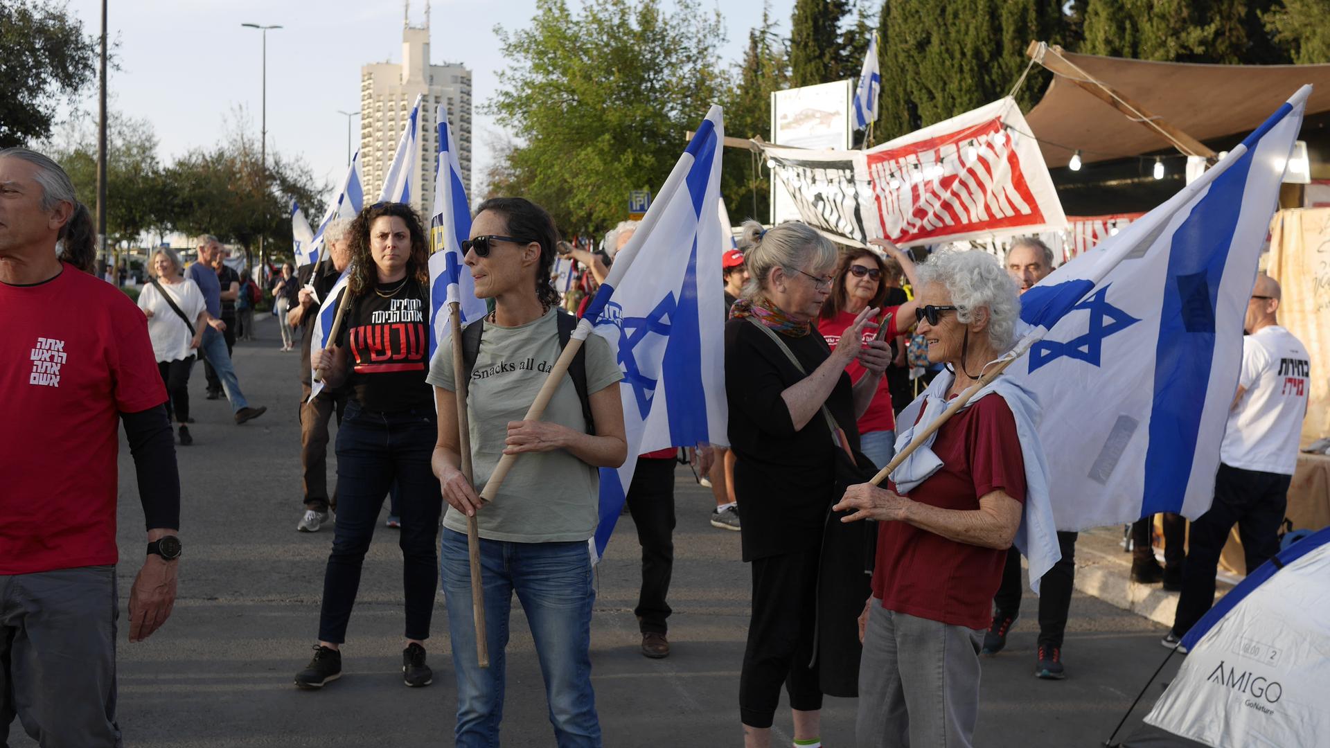 Israelis demonstrate outside the Knesset, Israel’s parliament, to call for new elections, Jerusalem, April 1, 2024.