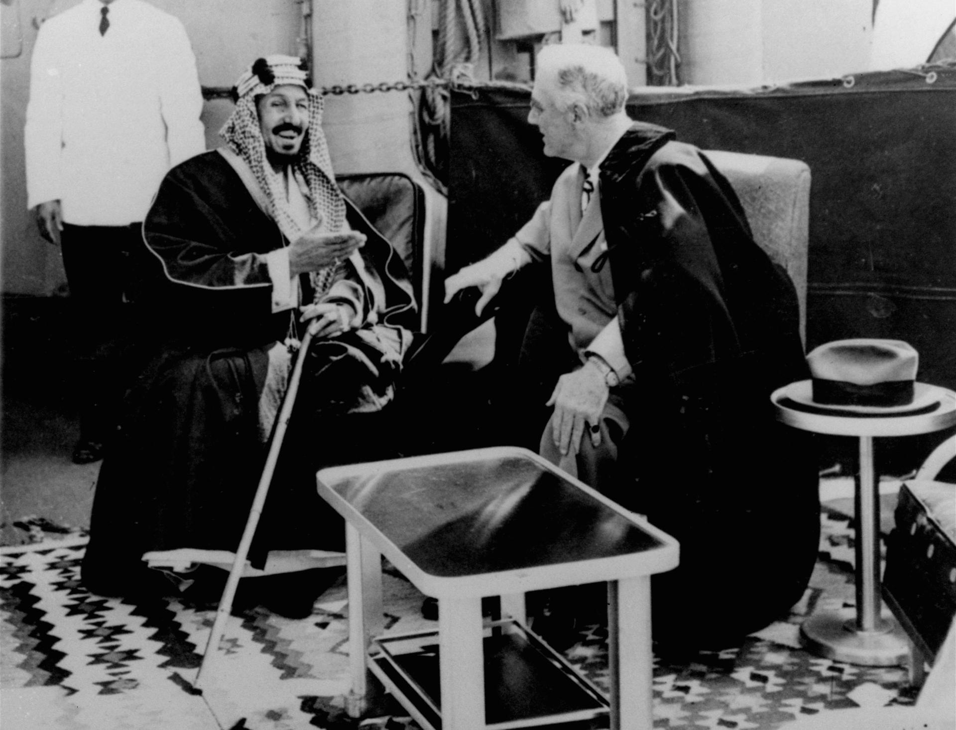 US President Franklin D. Roosevelt and Saudi King Abdulaziz Ibn Saud discuss Saudi-US relations aboard the USS Quincy in the Great Bitter Lake north of the city of Suez, Egypt, Feb. 14, 1945.